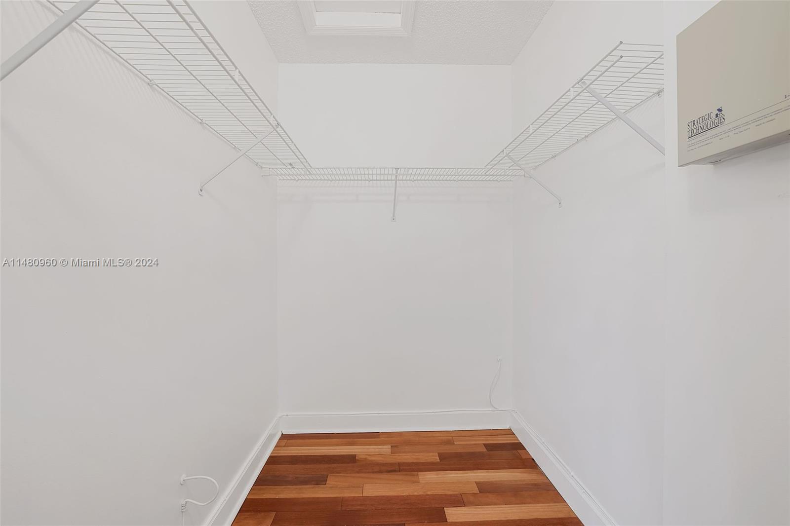 One of two walk-in closets in master bedroom