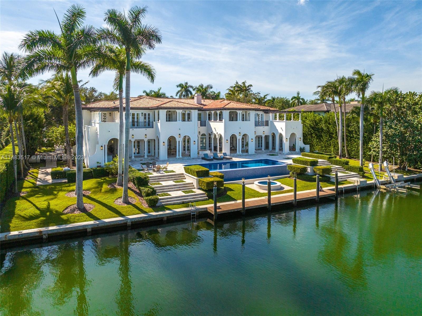 This breathtaking California Modern Spanish WATERFRONT home is in the highly desirable GATED community of GABLES ESTATES. This 10,942 Sf Home has 180 ft of water frontage & a private dock with no bridges to the bay sitting on a 38,289 SF lot. This grand estate offers 8 bedrooms, 8 full baths, 3 half baths, Crestron smart house, surround sound in every room, private balconies with lush views, and various outdoor amenities, including a cabana spa, infinity pool, and more. The primary suite boasts top-of-the-line features and two walk-in closets. With 3 jr suites, 2 staff rooms, the primary suite on the second floor, elevator ready, and a guest suite on the first floor. Ideally located near the best private schools in Miami, this property is perfect for any family to call home.