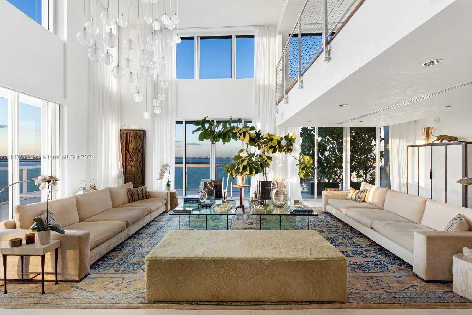 Enjoy 270-degree panoramic views of Miami’s Skyline, Biscayne Bay, Venetian Islands, and the ocean from the top floor of the Grand Venetian. This 4,750 sq. ft. two-story PH features two wrap-around balconies and 22 ft. floor-to-ceiling windows. The 1st level contains a primary suite w/ a steam sauna, an open kitchen w/ 2 dishwashers, 2 refrigerators & 3 freezers, and an open living and dining area perfect for entertaining. The 2nd level offers 2 guest suites, a media room w/ a bar, and an office/loft. This home in the sky has Miele and SubZero appliances & slate, wood, marble, and limestone flooring throughout. Located on Belle Isle, you are steps away from Sunset Harbor, Lincoln Rd shopping, & more. Building amenities include a pool, hot tub, BBQs, gym, tennis court, valet, security, etc.