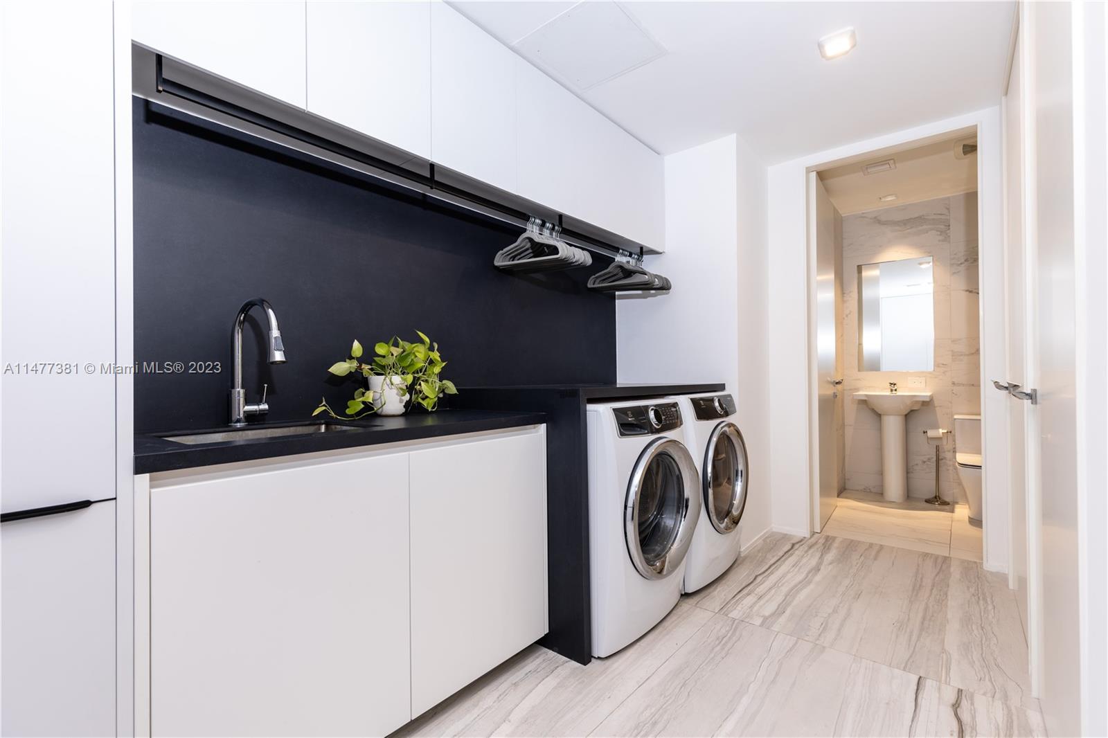 Laundry / Service Room + Full Bathroom