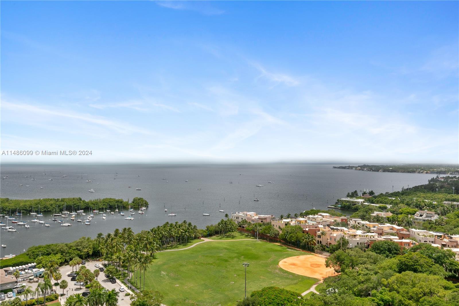 BACK ON THE MARKET REPRICED Magazine worthy renovation in this Coconut Grove dream condo. Views of the glistening Blue waters of Biscayne Bay and sunsets that are mesmerizing. Located in full service resort style hotel condo. No Rental restrictions affords the owner many options for rentals or private residence.Upgraded high impact floor to ceiling doors, electric shades including black outs,new kitchen with marble counters Bath with Huge spa like  shower ,wood floors,custom italian interior doors,primary walk in closet professionally racked out for maximum storage, office nook,nest thermostats, creative Stroage throughout. Possible to convert to a 2 key unit.