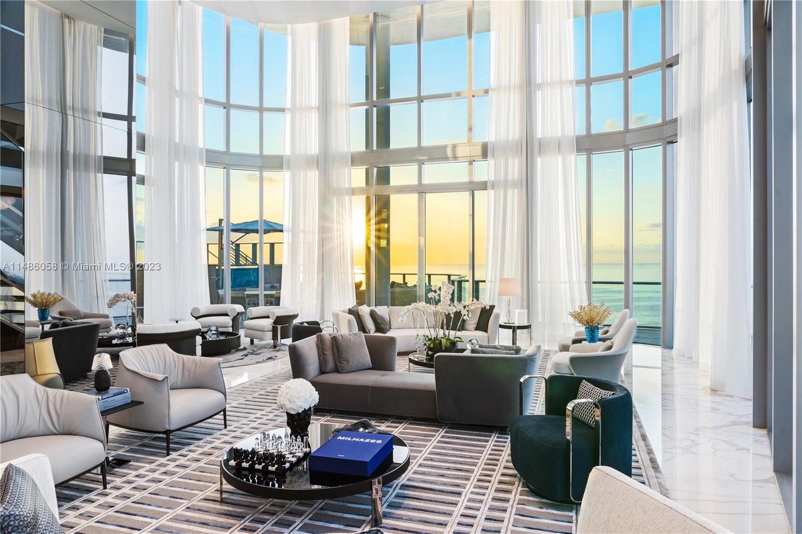 The epitome of high-end living. Be the first one to live in this ultra-luxurious fully furnished 2-story PH residence at Chateau Beach Residences in Sunny Isles Beach. Spanning the entire 32nd and 33rd floors, this bright & airy residence, features 4BD/5+3 BA. The home's 2nd floor showcases a separate principal suite wing w/ a den, gym, dual walk-in closets, beauty massage room & sauna. Features include a spacious great room, a family/media room, private elevator, custom millwork, Lasvit chandeliers, Italian furniture by Minotti, w/accessories by Lalique, Baccarat, Christoffle & FENDI. Boasting expansive views of the Atlantic Ocean, Intracoastal Waterway, downtown Miami and Fort Lauderdale, the residence offers a 4,523 SF wraparound terrace w/ an outdoor pool deck & a private swimming pool