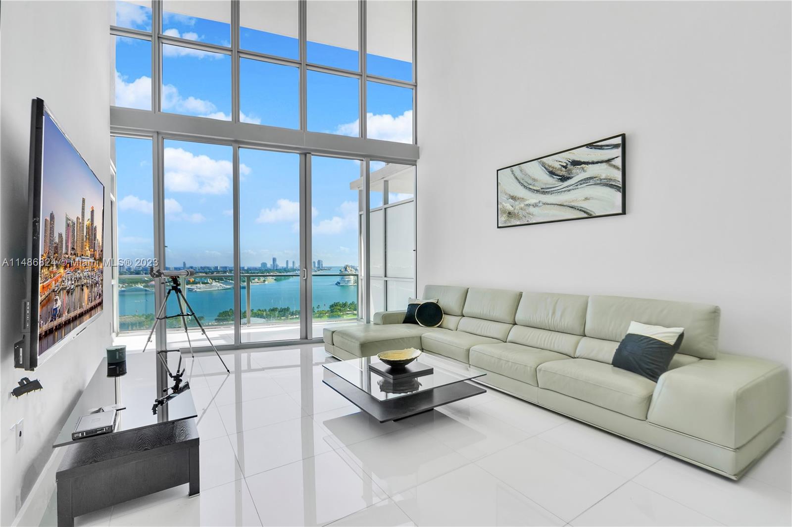 This stunning unit is located in the MARQUIS Residences in the prime of Miami’s Downtown area. 1,675 sq. foot living area on the 21st floor features high ceilings, creating a bright and inviting atmosphere overlooking the bay area right from its very own private balcony. The kitchen is equipped with top-of-the-line stainless steel appliances, sleek cabinetry, and a large center island. The master bedroom is a true retreat, boasting a generous layout, indoor balcony, a spacious walk-in closet, and a private en-suite bathroom. The additional room provides versatility that can double as den or office and offers ample closet space. An in-unit washer and dryer are also included. Access to a range of amenities, including a state-of-the-art fitness center, a rooftop pool, and garage parking.