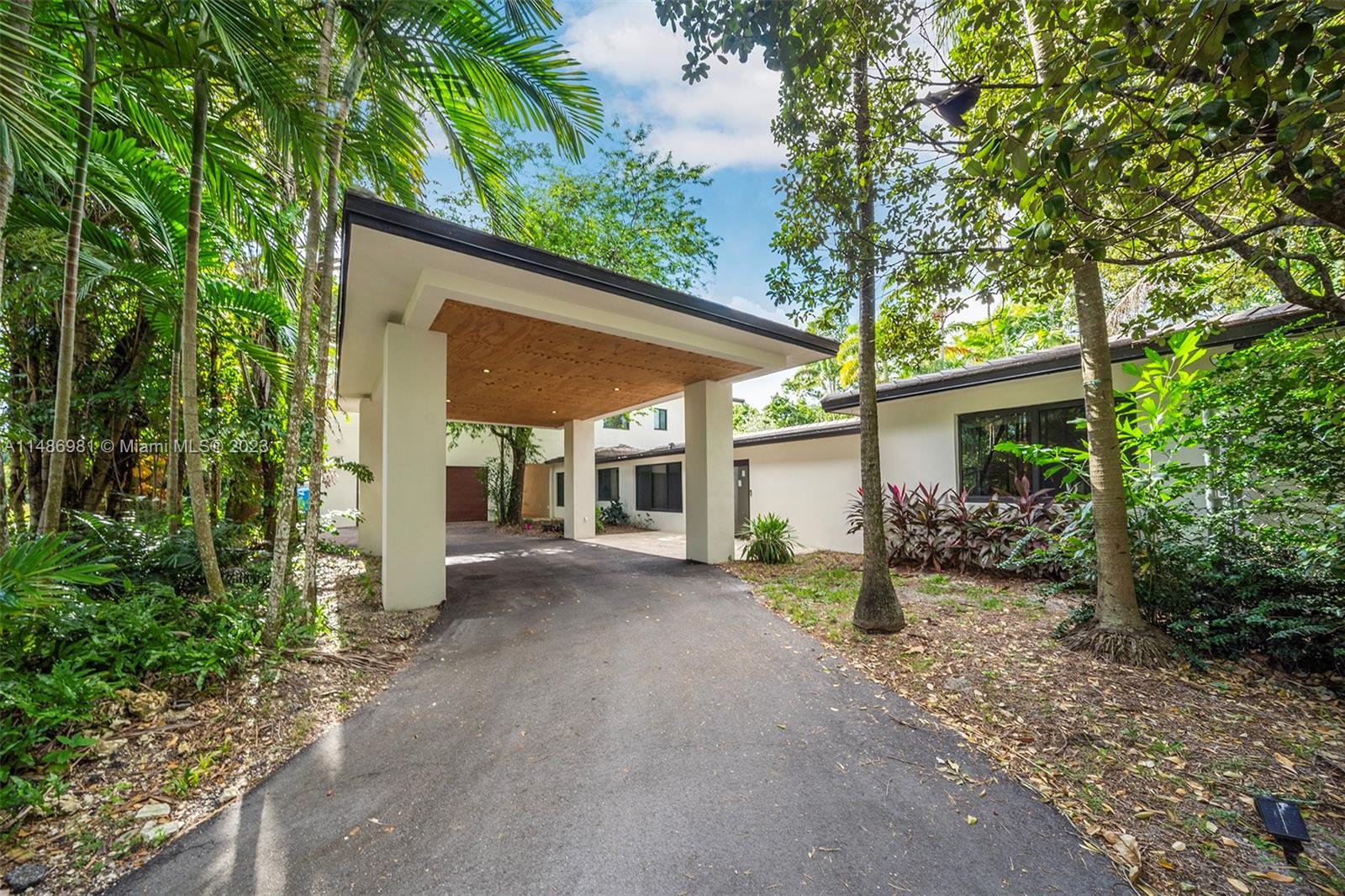 A one of a kind tropical oasis in South Miami. This unique property has been completely transformed, sitting on over an acre lot. Some impressive features include: A fully remodeled kitchen with ample amount of cabinet space, a U-shaped driveway w/ covered parking, All bedrooms have their own private bathroom, a mother-in-law suite, a Master suite with a balcony,  a stunning master bathroom spa, a personal Office/ meditation room, a fenced dog run on the side of the home, an oversized bonus room currently being used as the pet spa attached to the 2 car garage & can be converted to an at-home gym. The backyard is an oasis with a summer kitchen, custom treehouse, & fully matured mango trees. Plenty of space for an at-home garden & so much more. Come check it out!