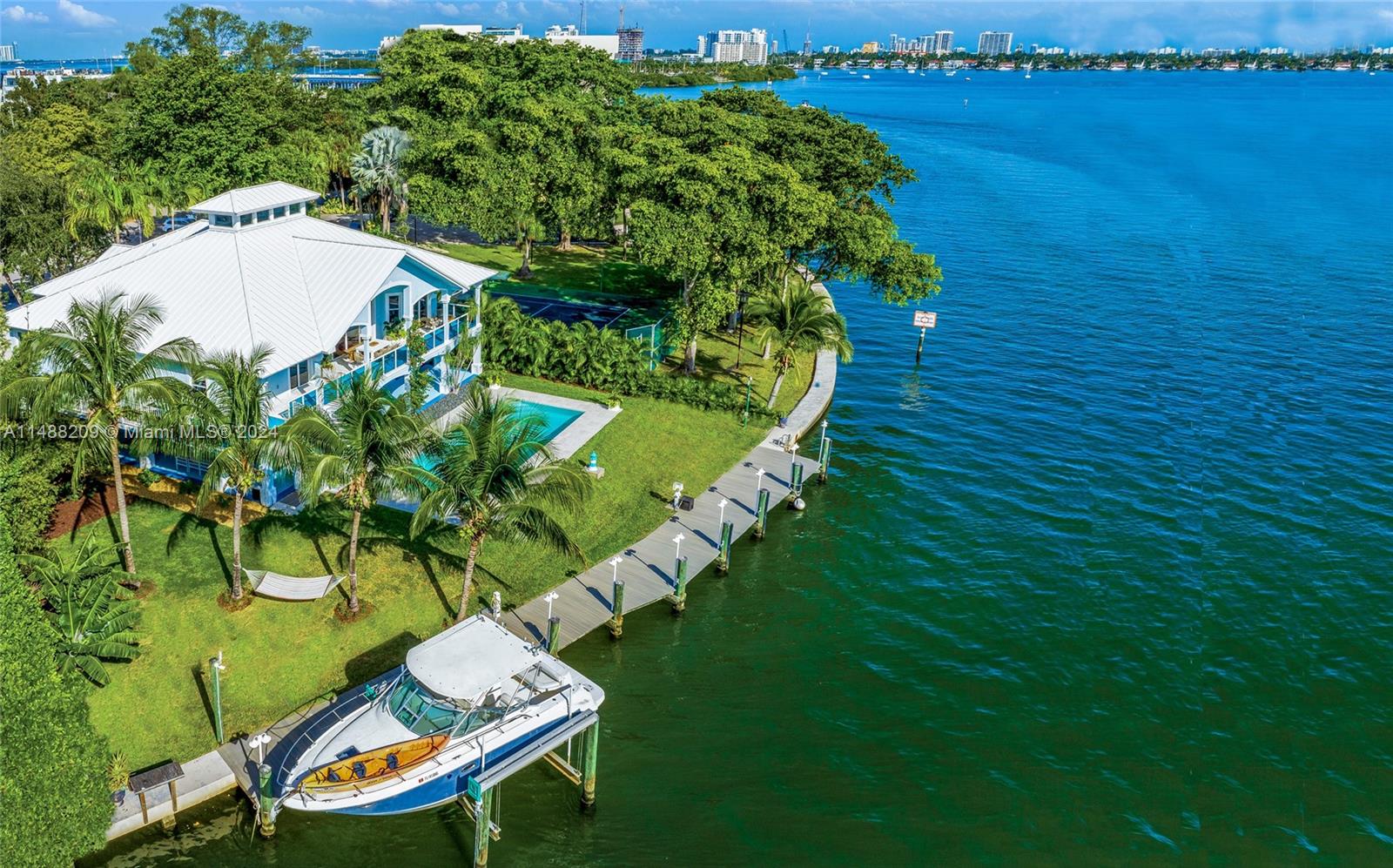 Welcome to this waterfront estate situated on a spacious 12,815 SF lot, with 120 feet of dock space along Biscayne Bay, perfect for a yacht of 80 feet. Enjoy relaxation and entertainment on the expansive wraparound covered patio and vibrant garden with a large pool. The completely renovated 6,572 SQ construction area boasts high ceilings and a 25-FT skylight, along with surrounding terraces. Additional features include a service room with full bathroom, playroom, and elevator. Ideally located near private schools, top restaurants, and shopping centers, this property offers a unique opportunity for future expansion. The property is available for lease fully furnished for a minimum of three months, starting from August 1st. Owner Financing Available.