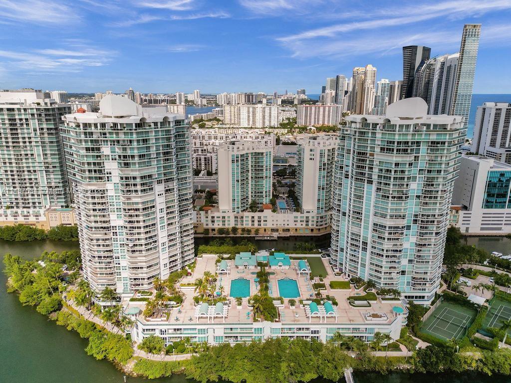 This Oceania Tower IV in Sunny isles beach residence is offering a luxurious lifestyle with its corner unit featuring 3 bedrooms, 3 bathrooms, and stunning views of the ocean, intracoastal, and city, Downton Miami skyline. The wrap-around balcony adds to the allure, and the interior boasts marble floors in living areas and a cozy touch with bedroom carpets. The amenities, including restaurant, tennis, racquetball, beach service, pool, gym, spa, fitness center, fitness classes, social activities marina and more, contribute to a resort-like experience. Security, concierge and valet 24 hours. 
Its convenient location near Bal Harbour shops and Aventura Mall enhances its appeal.