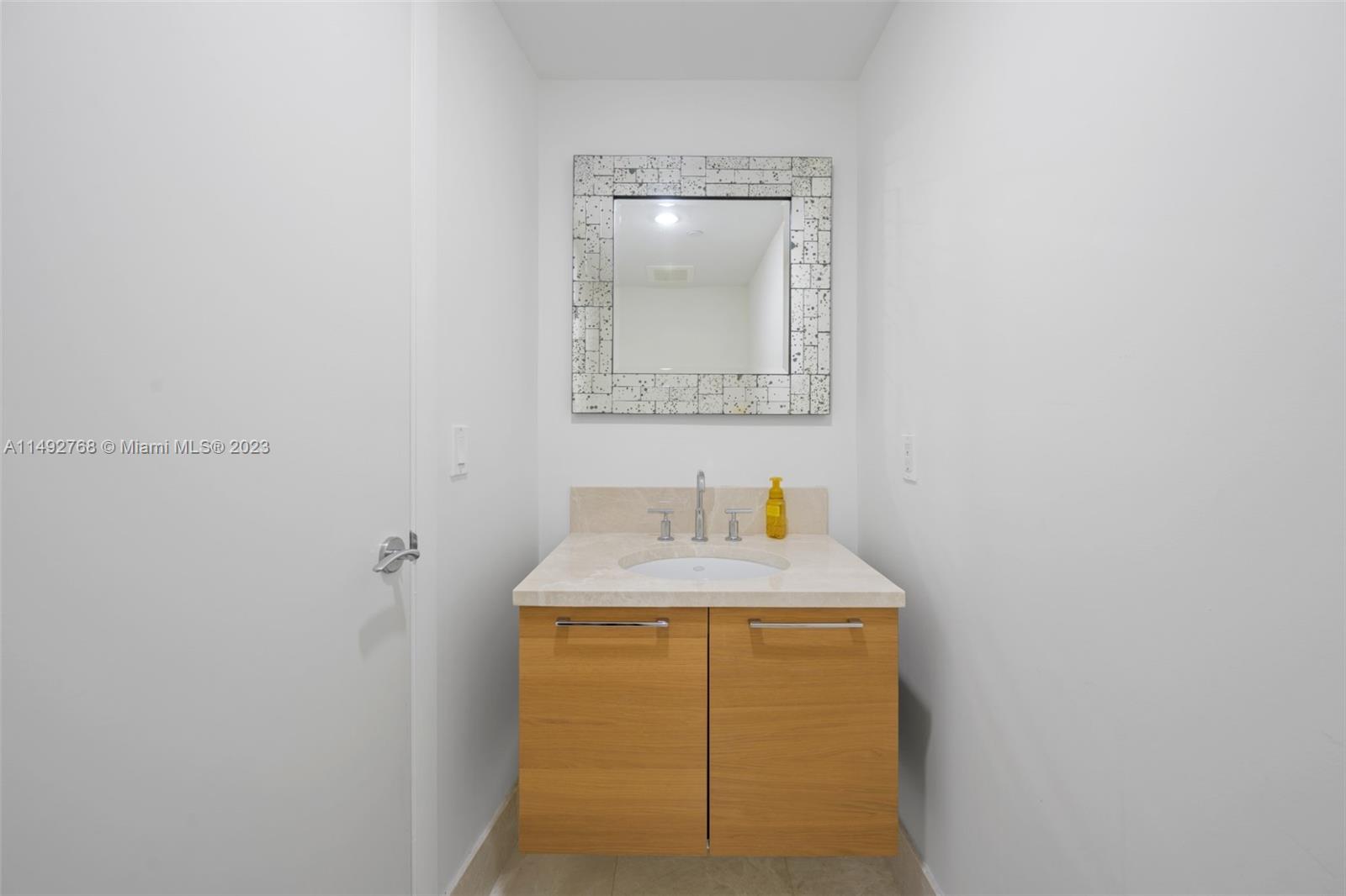 Half Bath located off the kitchen and social areas