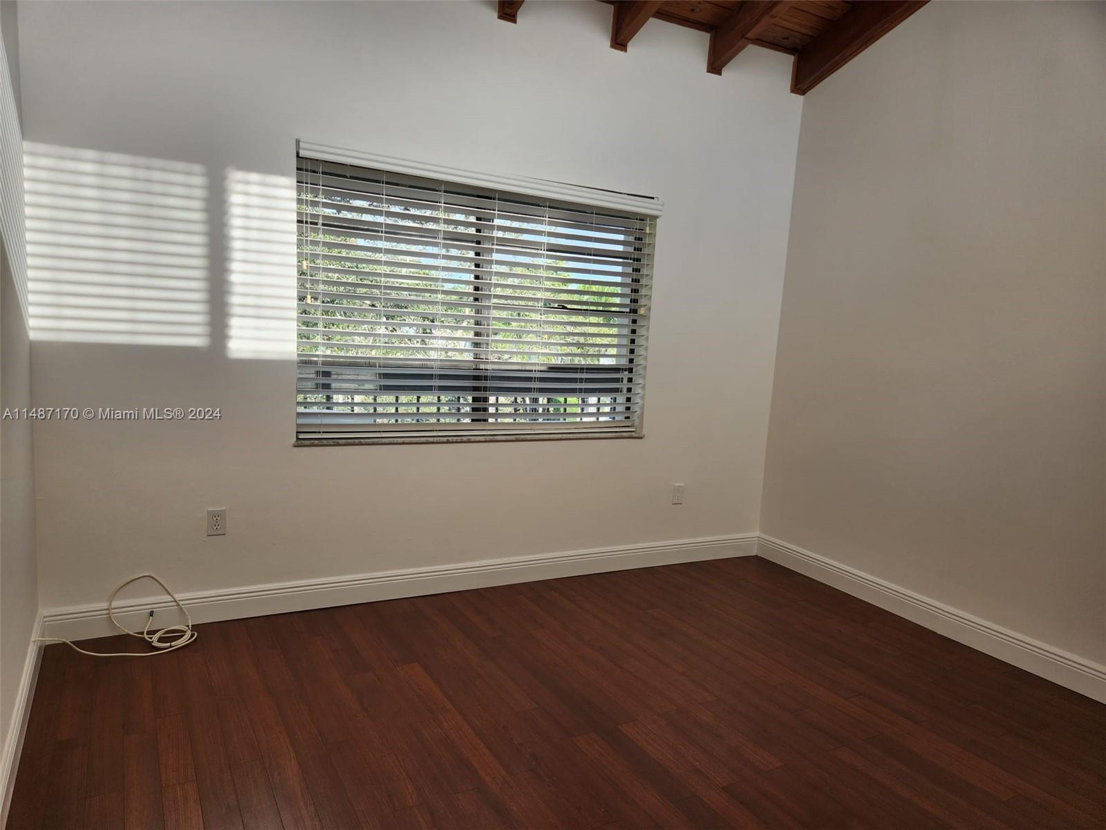 Second bedroom shows view of balcony and canal through the window.