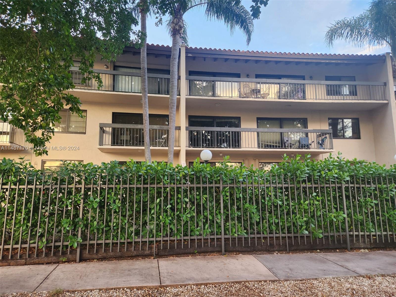 Three story building with 6 units on each floor, fenced and gate property.