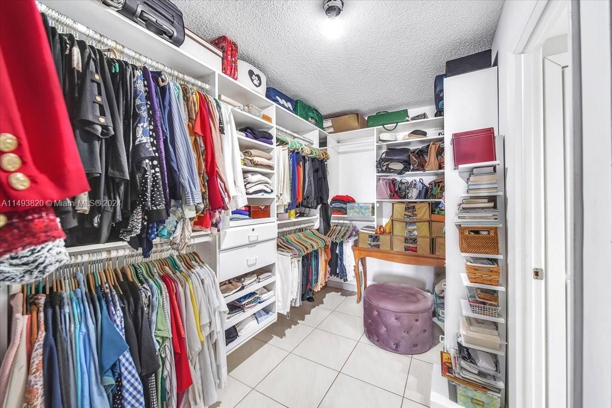 Primary bedroom walk in closet