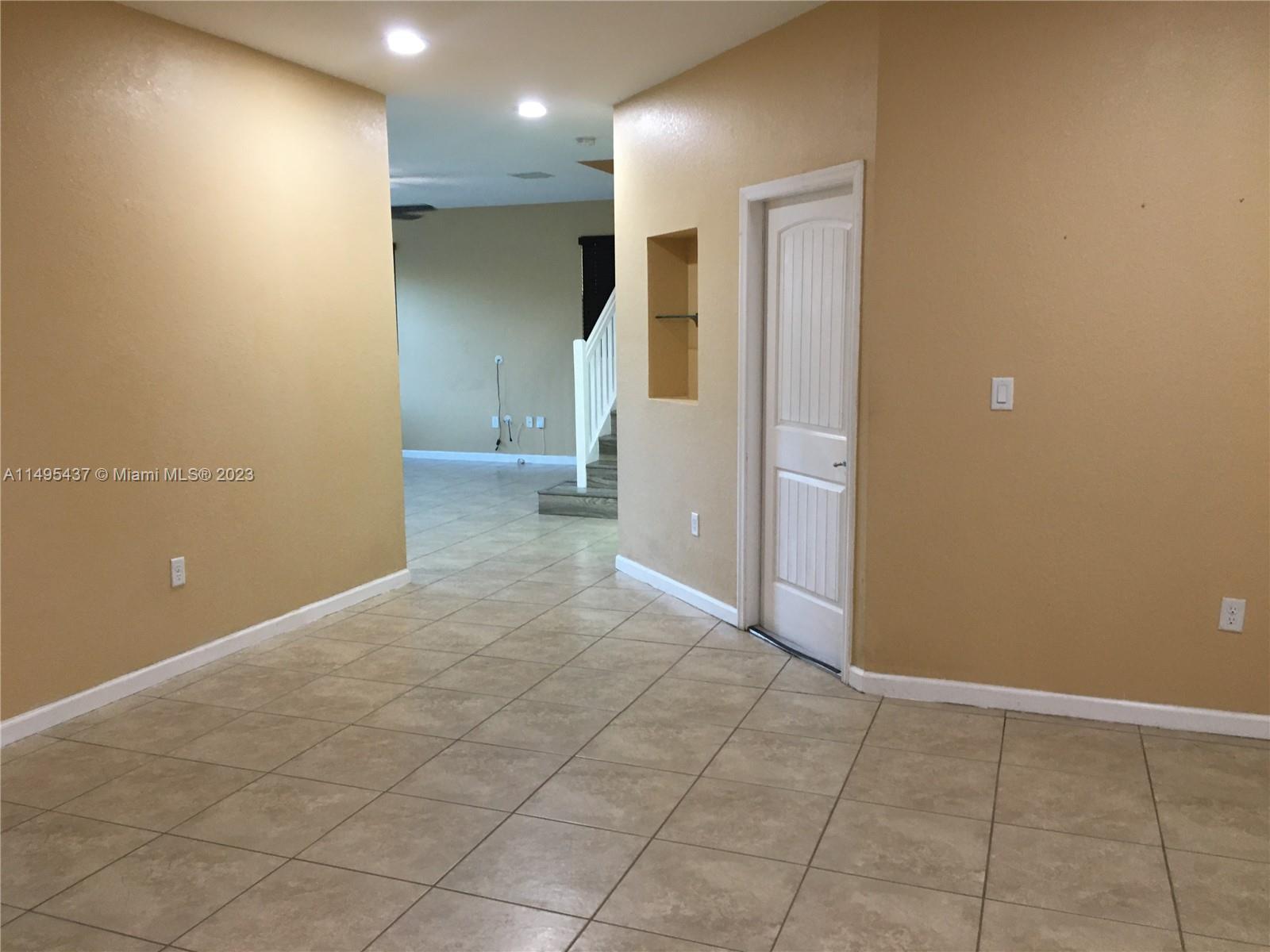 Living Room facing garage door & Family Room