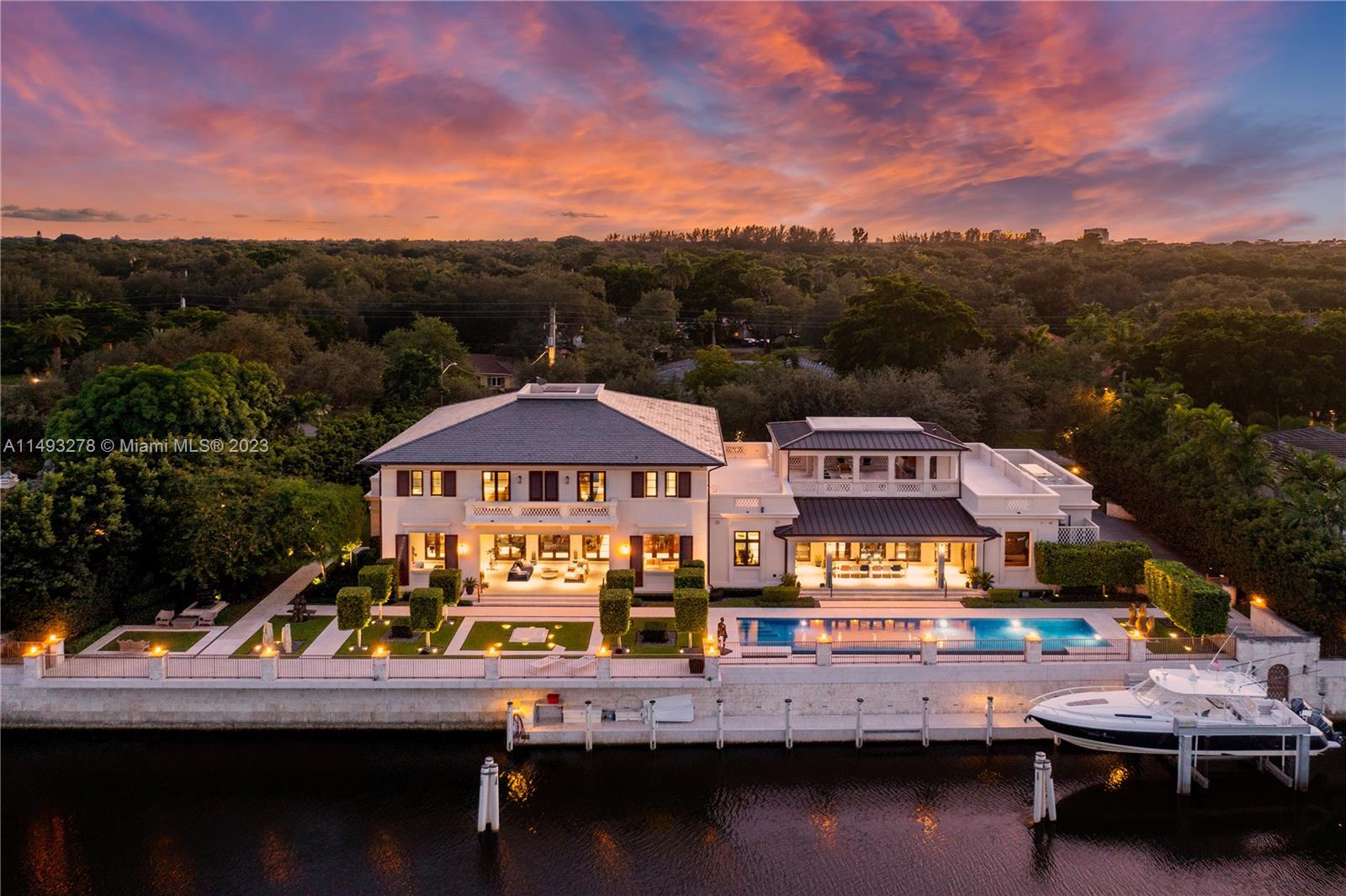 Masterful design & luxury are showcased in this 6BD, 7BA, 4HB custom-built waterfront home in highly-sought after Coral Gables. Enjoy the epitome of WF living w/ 200’ on the water, views of manatees & a refreshing ocean breeze. The outdoors captivate w/ an architectural sculpture garden, 60’ infinity pool, covered terraces & summer kitchen. Every detail of this remarkable 12,173 SF home was quality crafted. Residence features an expansive layout, volume ceilings, 2 elevators & a whole house generator. Chef's eat-in kitchen showcases elegant emerald quartz countertops, top-of-the-line appliances, oversized island w/ seating & separate breakfast area. Enjoy sunrises & sunsets from a spacious rooftop veranda. Additional features: wine cellar, service quarters, 3-car garage & dual-gated entry.