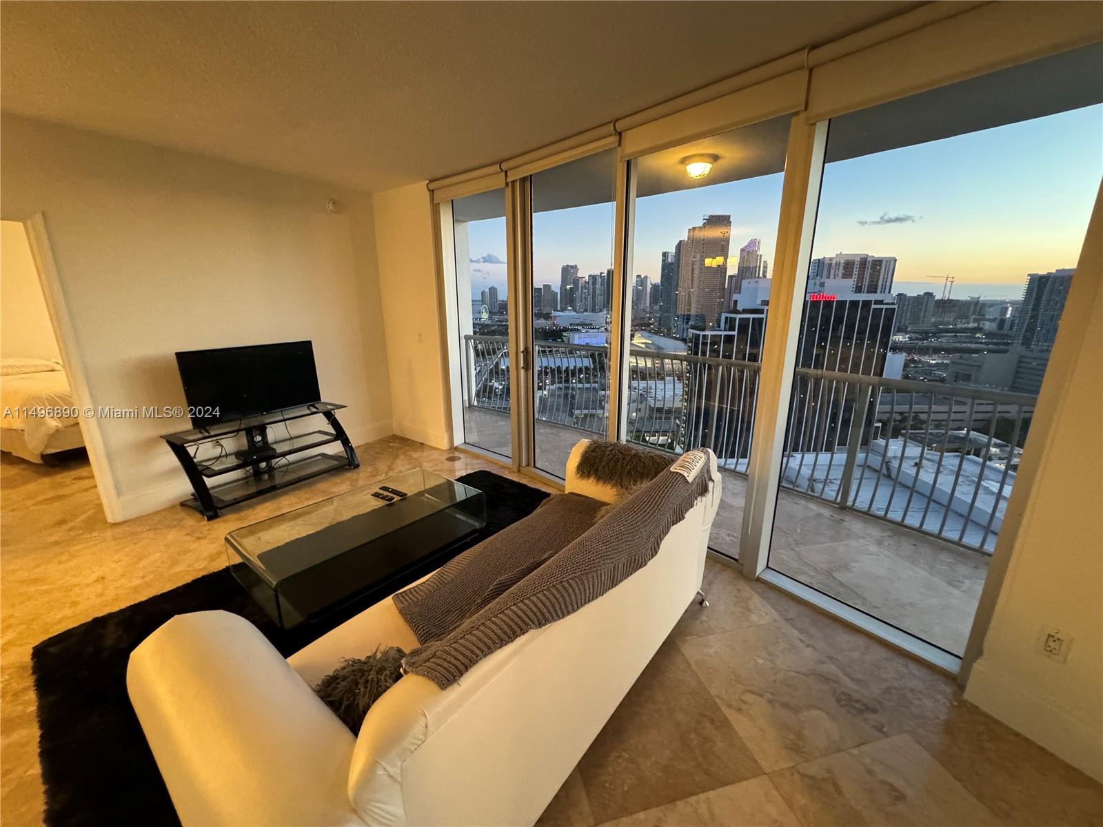 This beautiful 2 Bedroom 2 Bathroom unit with incredible Miami Downtown and Brickell view features marble floors, SS appliances, and a washer & dryer inside the unit. Building amenities are; Pool, jacuzzi, sauna, gym, and party/lounge room. PARKING SPACE INSIDE THE BUILDING.