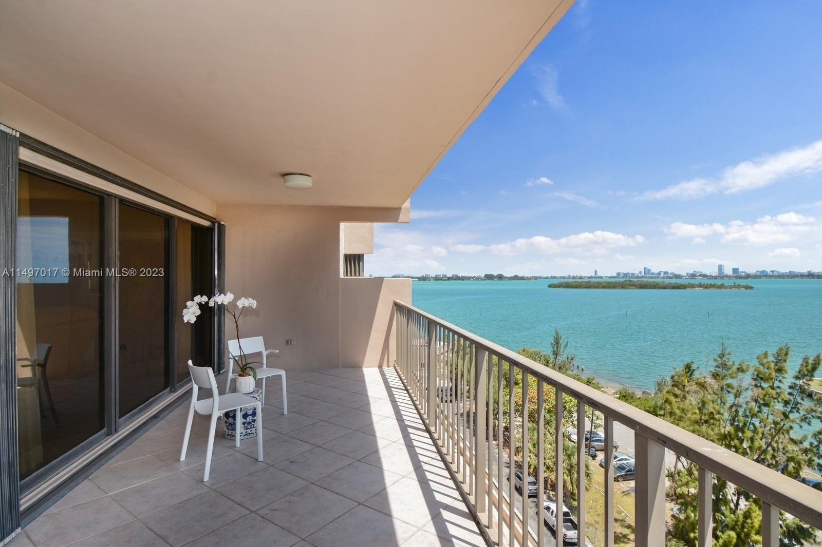 Oversized balcony with stunning water views. Windows with accordion hurricane shutters.