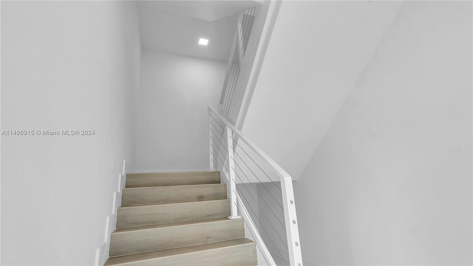 Stairs that lead to the Master Suite.