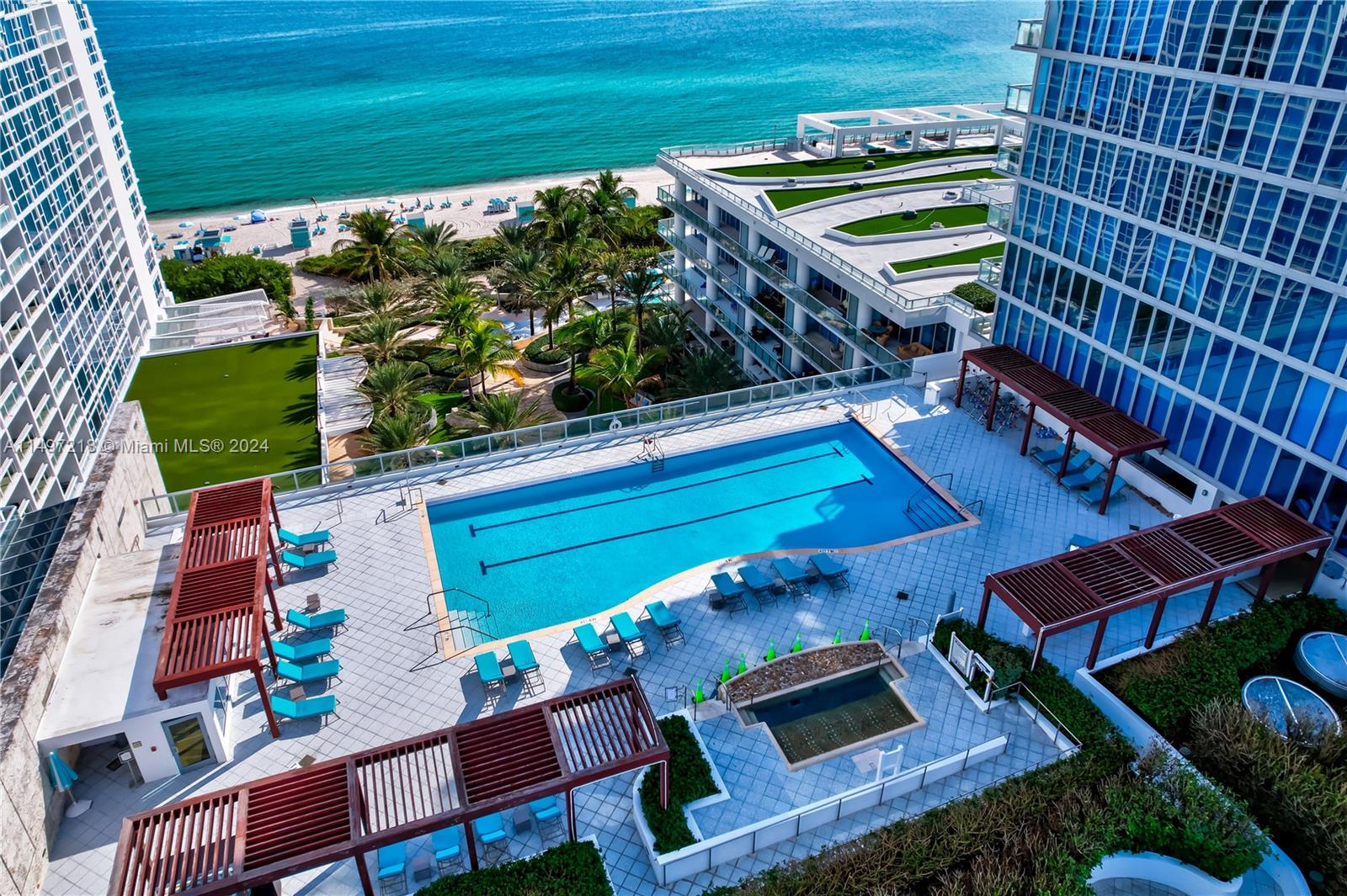 One of Four (4) swimming pools on property for which to enjoy! This beachfront one is surrounded by lush vegetation and adjacent to the boardwalk and beach.
