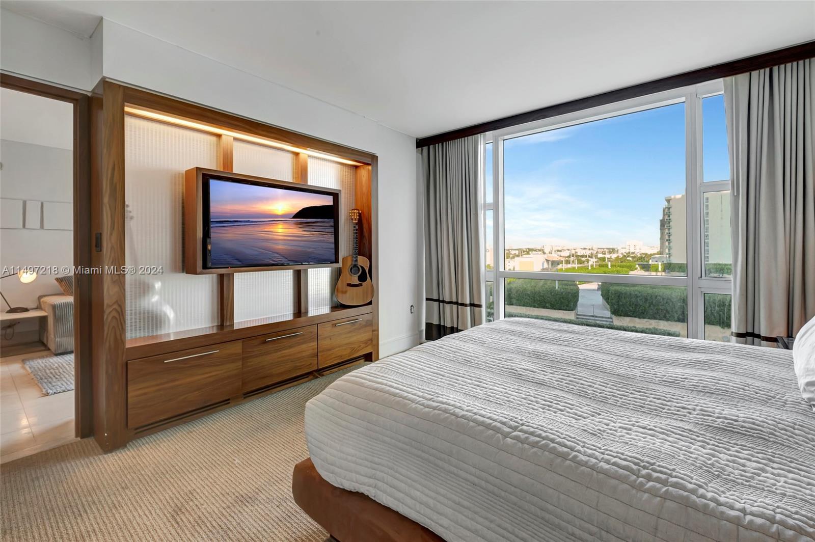 Large format TV in Bedroom.