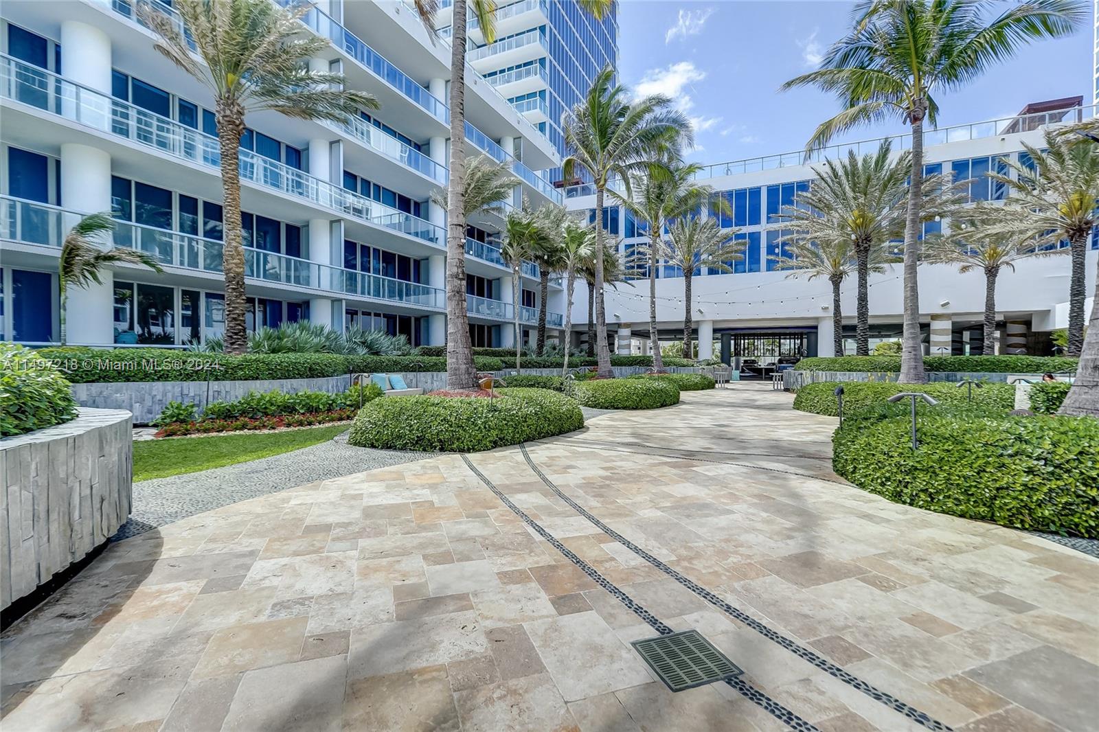 The exterior courtyard pathways leading to both of the beachside pools and to the beach offer a place to meditate and reflect in comfortable outdoor seating.