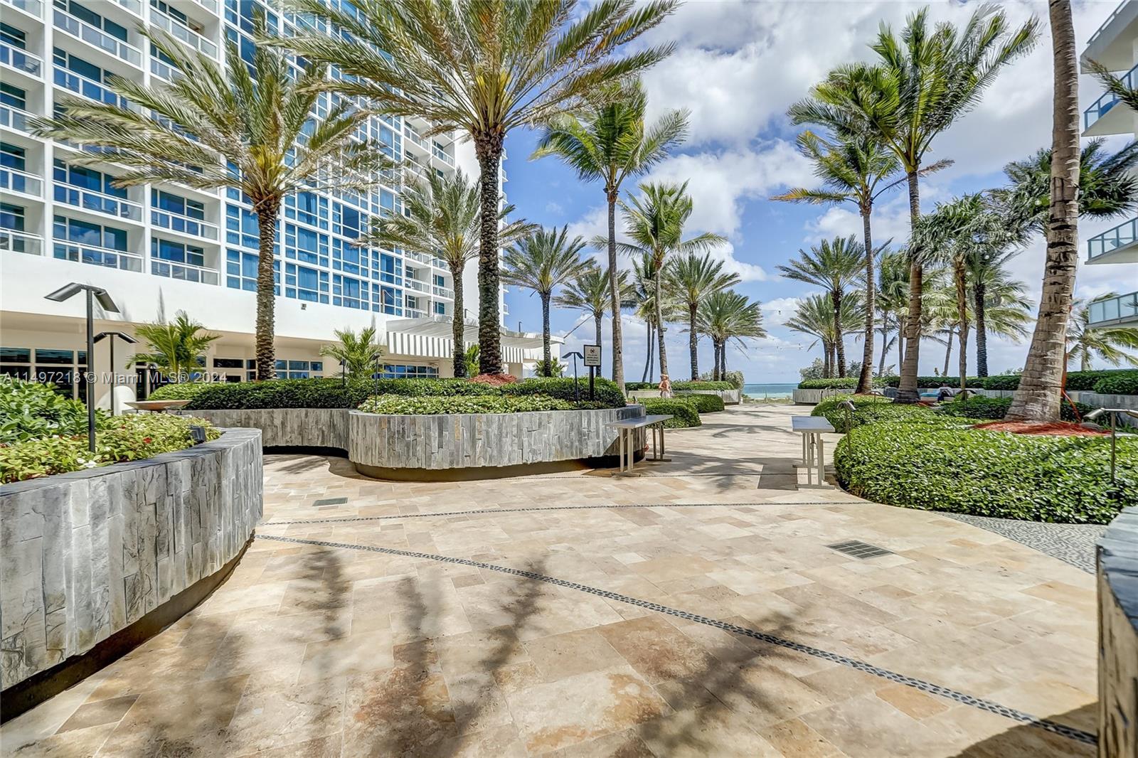 The exterior courtyard pathways leading to both of the beachside pools and to the beach offer a place to meditate and reflect in comfortable outdoor seating.