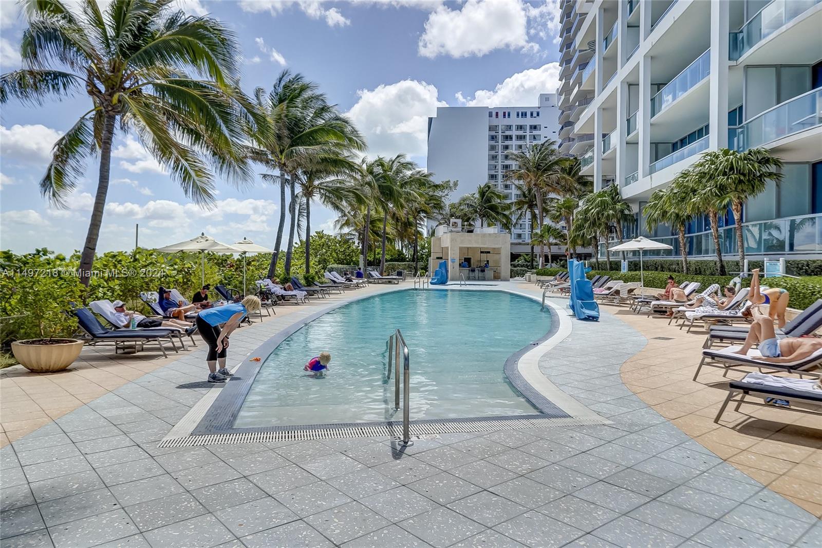 One of Four (4) swimming pools on property; this one with an outdoor bar. Do I hear Pina Colada? Why not? It's your vacation today and everyday!