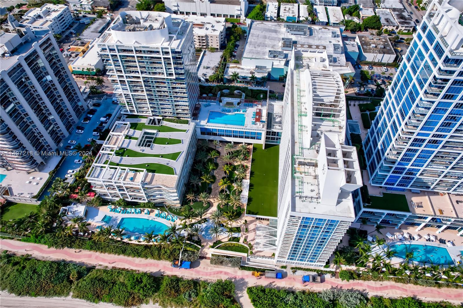 Aerial view of the expansive oceanfront property encompassing the 4 pool decks et al.