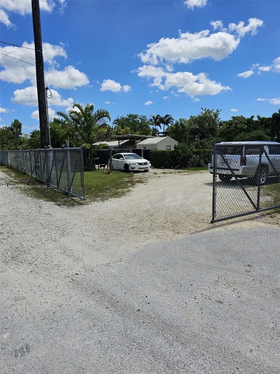 ENTRANCE OFF OF KROME AVE W/ AN XLARGE AGTE OPENING ON AN ANGLE APPROX 32 FEET WIDE