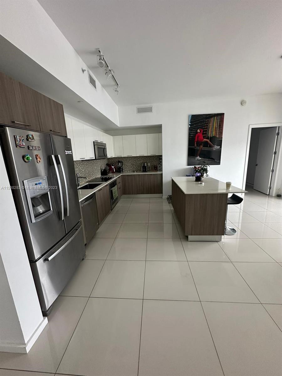 Beautiful Kitchen with Stainless steel appliances.