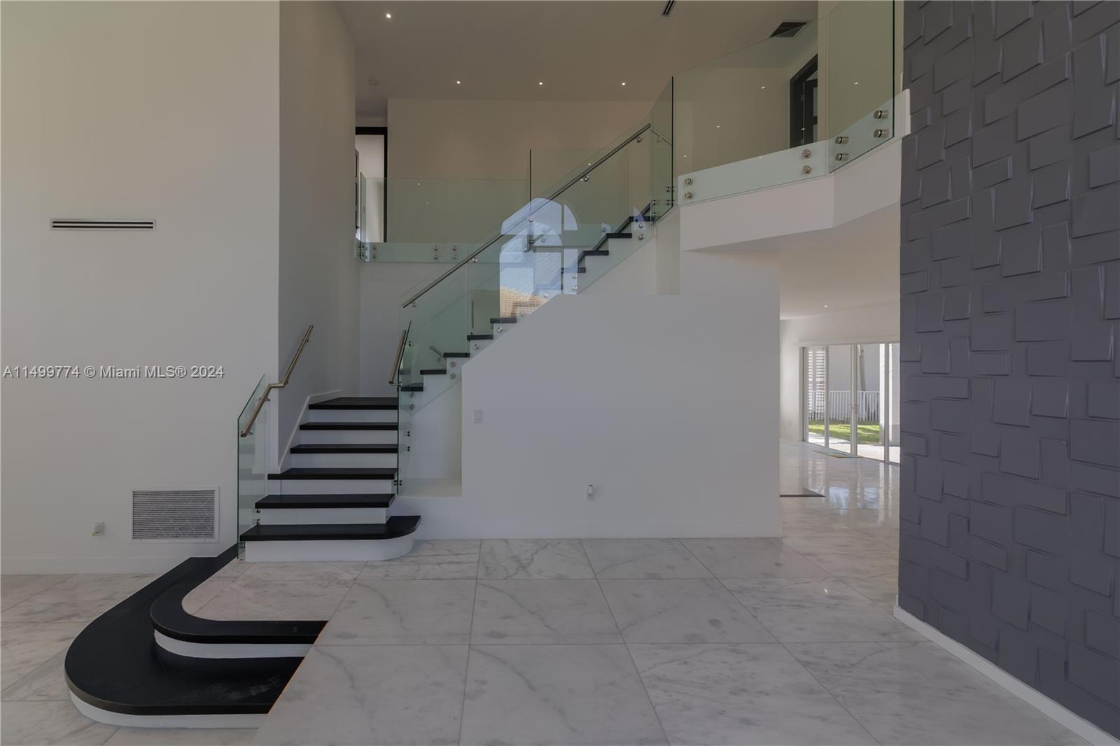 The glass balustrade, on the other hand, adds a sense of lightness and contemporary style to the staircase. The transparency of the glass allows for unobstructed views of the surrounding area, creating a sense of spaciousness and flow. Additionally, it allows natural light to filter through, illuminating the staircase in a graceful manner.