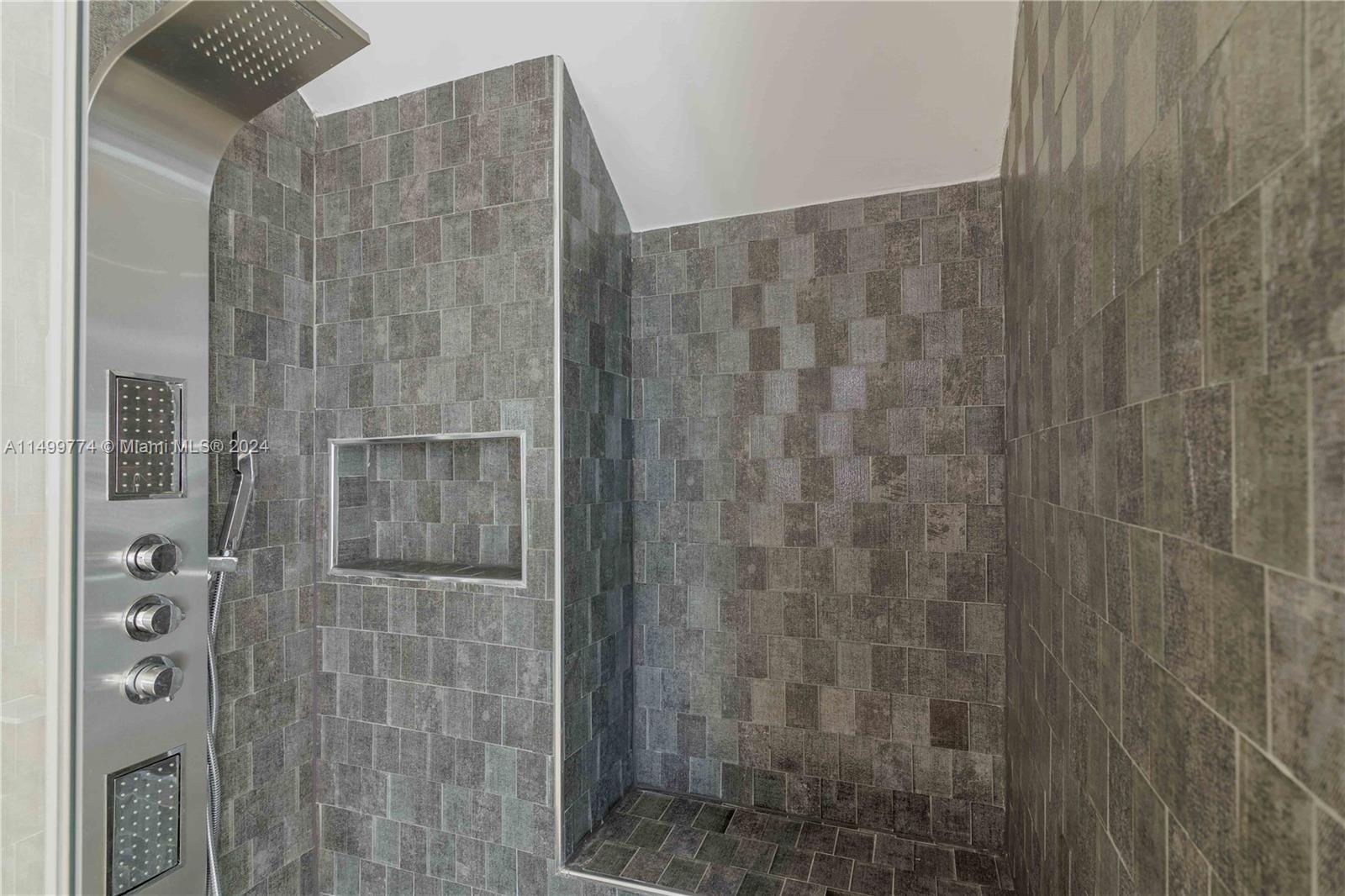 The shower in the full bathroom is an area for relaxation and cleansing. It is equipped with modern faucets and fixtures that make it easy to use and adjust the water temperature. The shower walls and floor are typically tiled or made of water-resistant material to ensure durability and ease of cleaning.