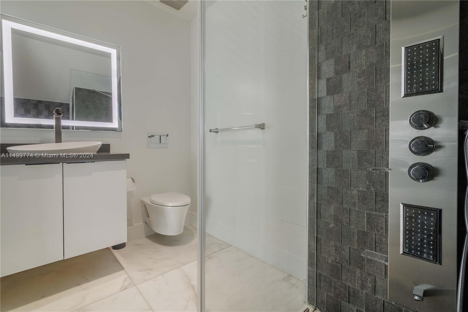 The mirror above the vanity is an essential element in the bathroom. It provides a place for residents to primp and prepare for the day. The mirror also adds a decorative touch to the space, complementing the overall bathroom design.