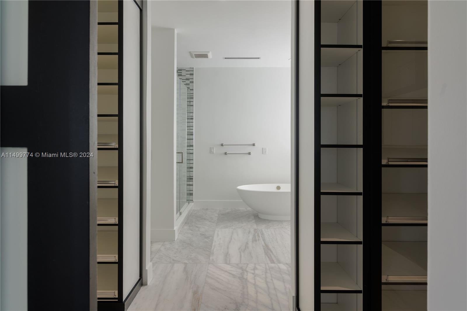 This luxurious double closet is located in the master bedroom and is a distinctive feature that adds convenience and functionality to the space.