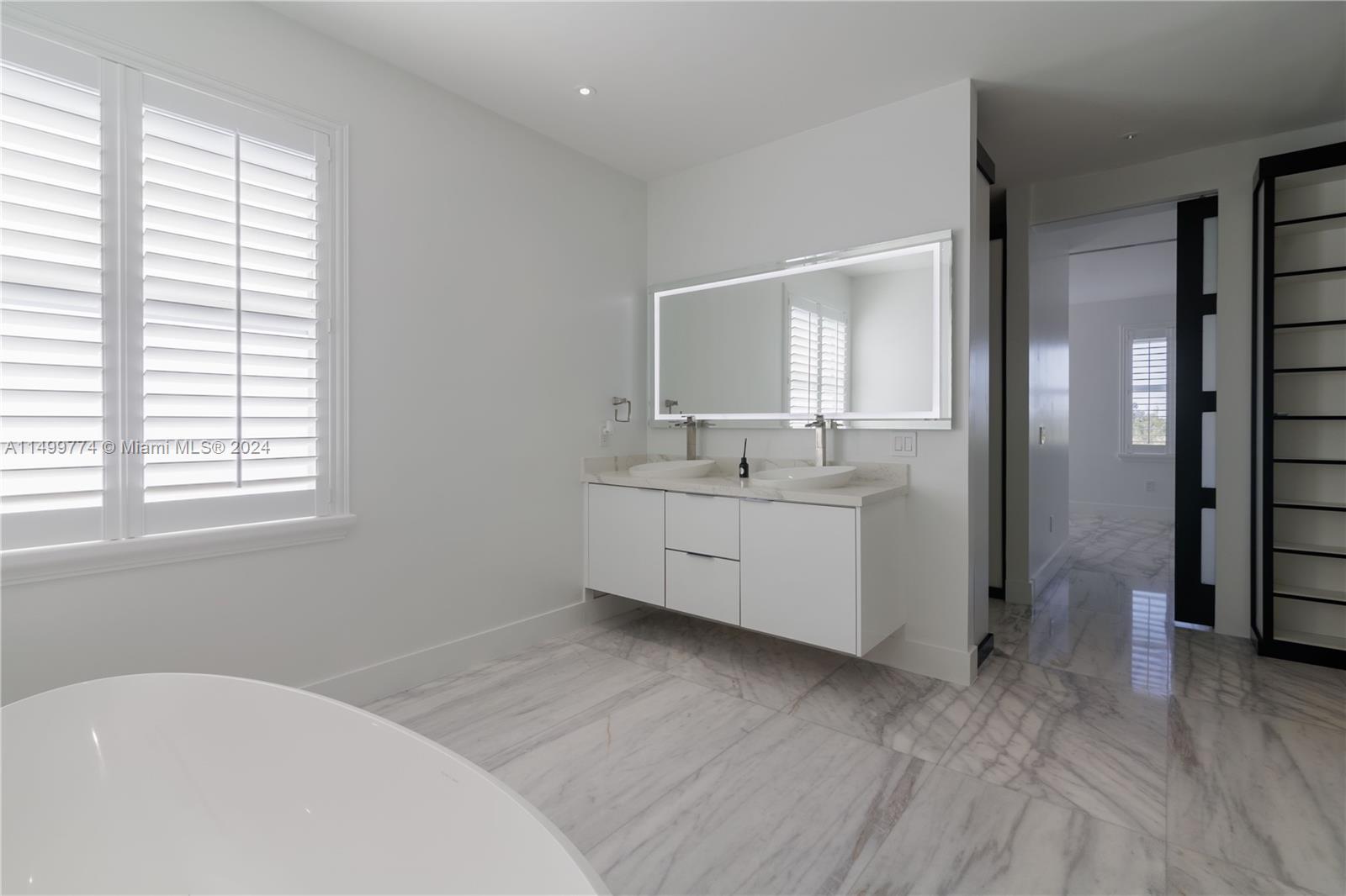 The bathroom's design is oriented towards luxury and comfort, providing a sanctuary within the home.