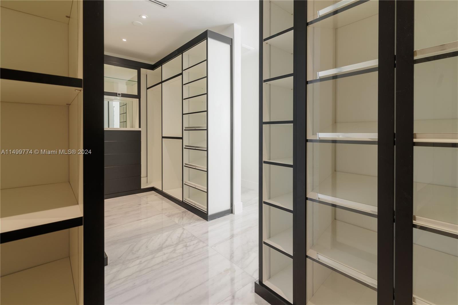 Each compartment of the closet is designed to meet the storage needs of the homeowner. There may be shelves, clothing hanging rods, drawers, and other organizational elements on each side