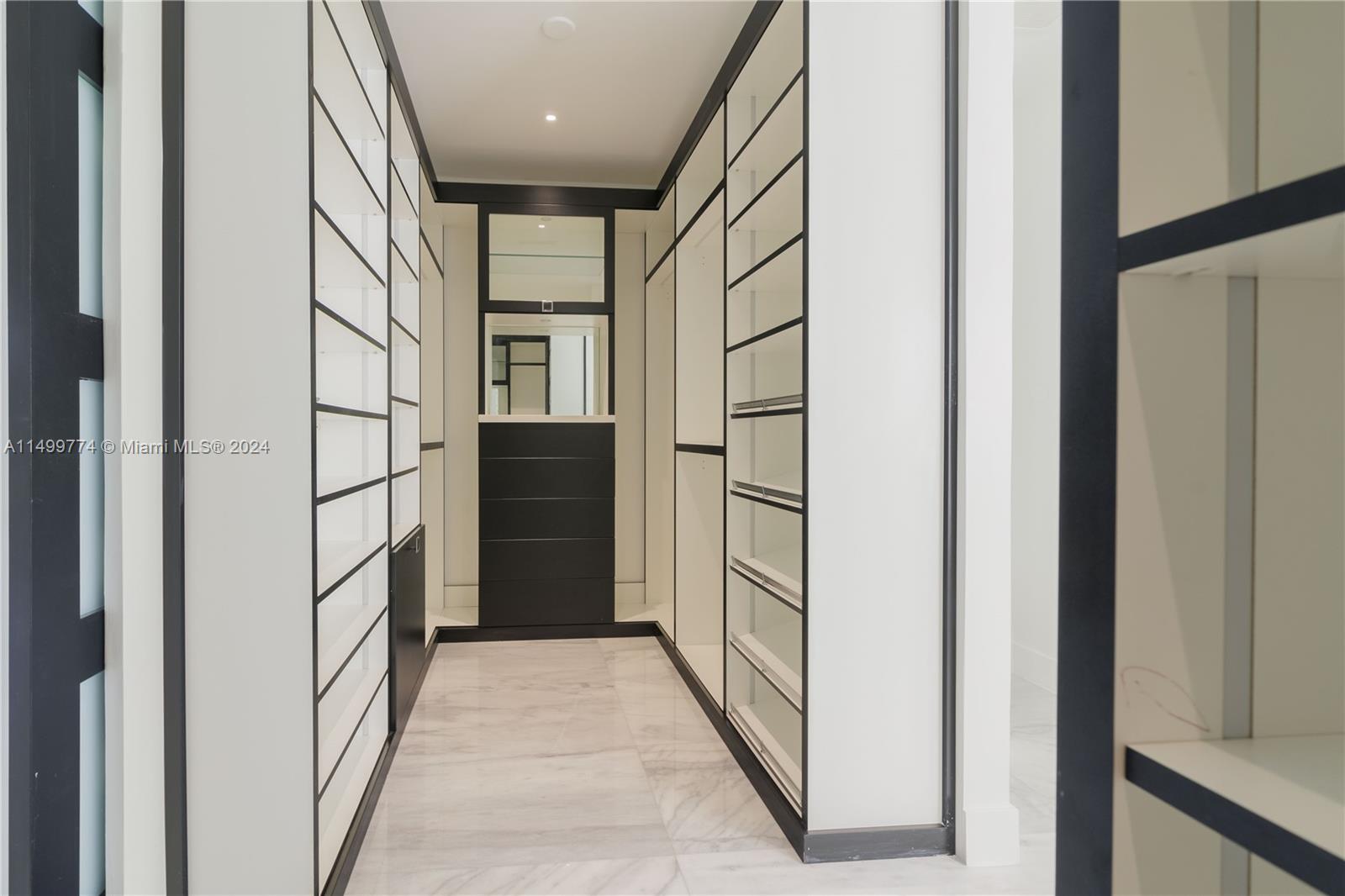 The closet is divided into two separate compartments, one on the right and the other on the left, each with its own door or independent access