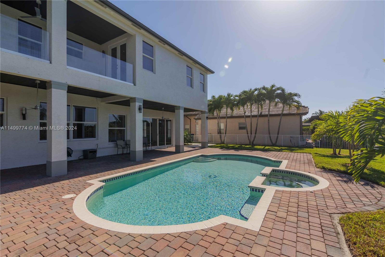 The pool may be surrounded by a paved pool area, providing a comfortable space for placing lounge chairs, chairs, and tables for sunbathing and relaxation.