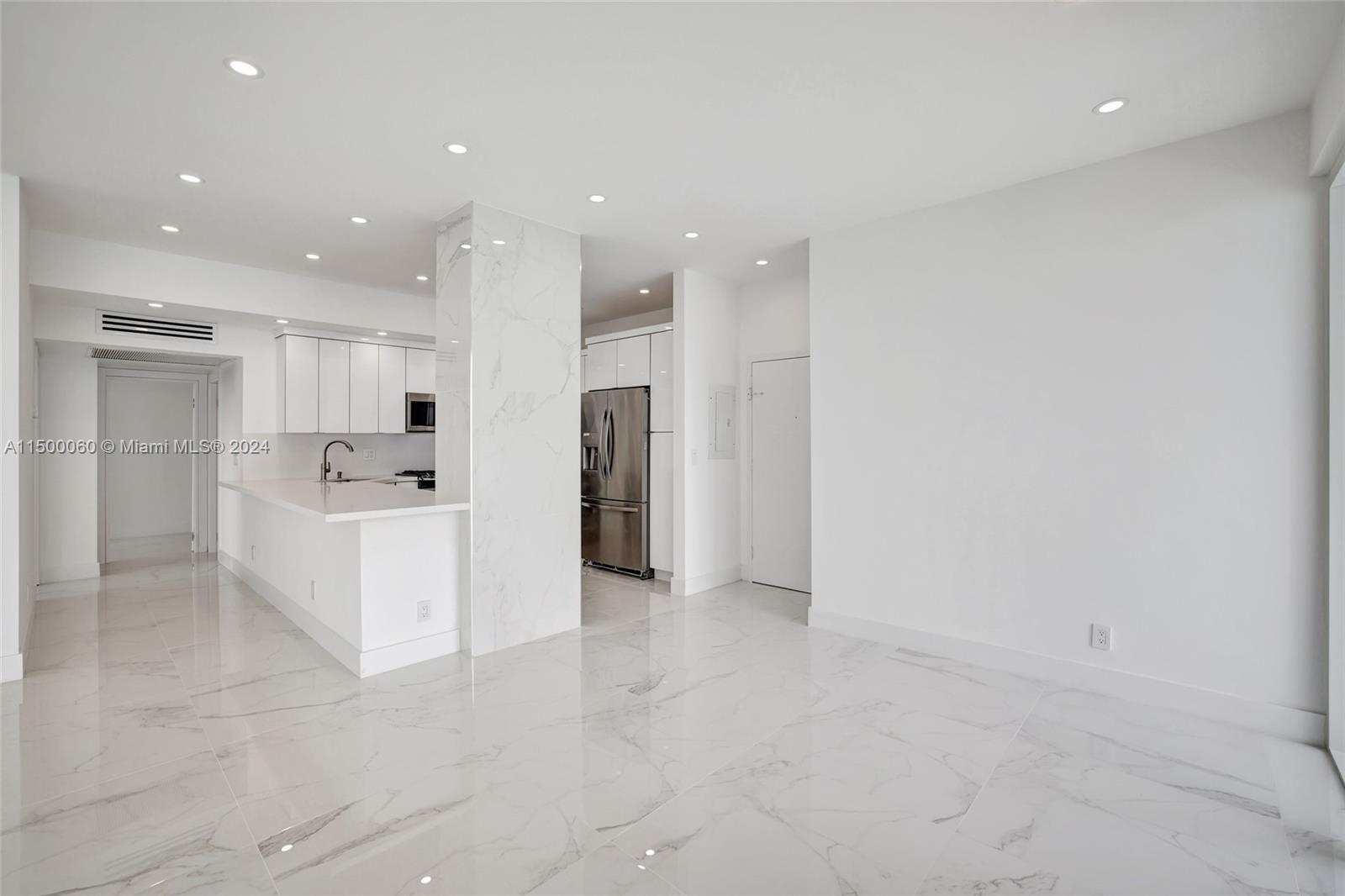 DINING ROOM MAIN ENTRANCE WITH FLOOR-TO-CEILING OCEAN VIEWS