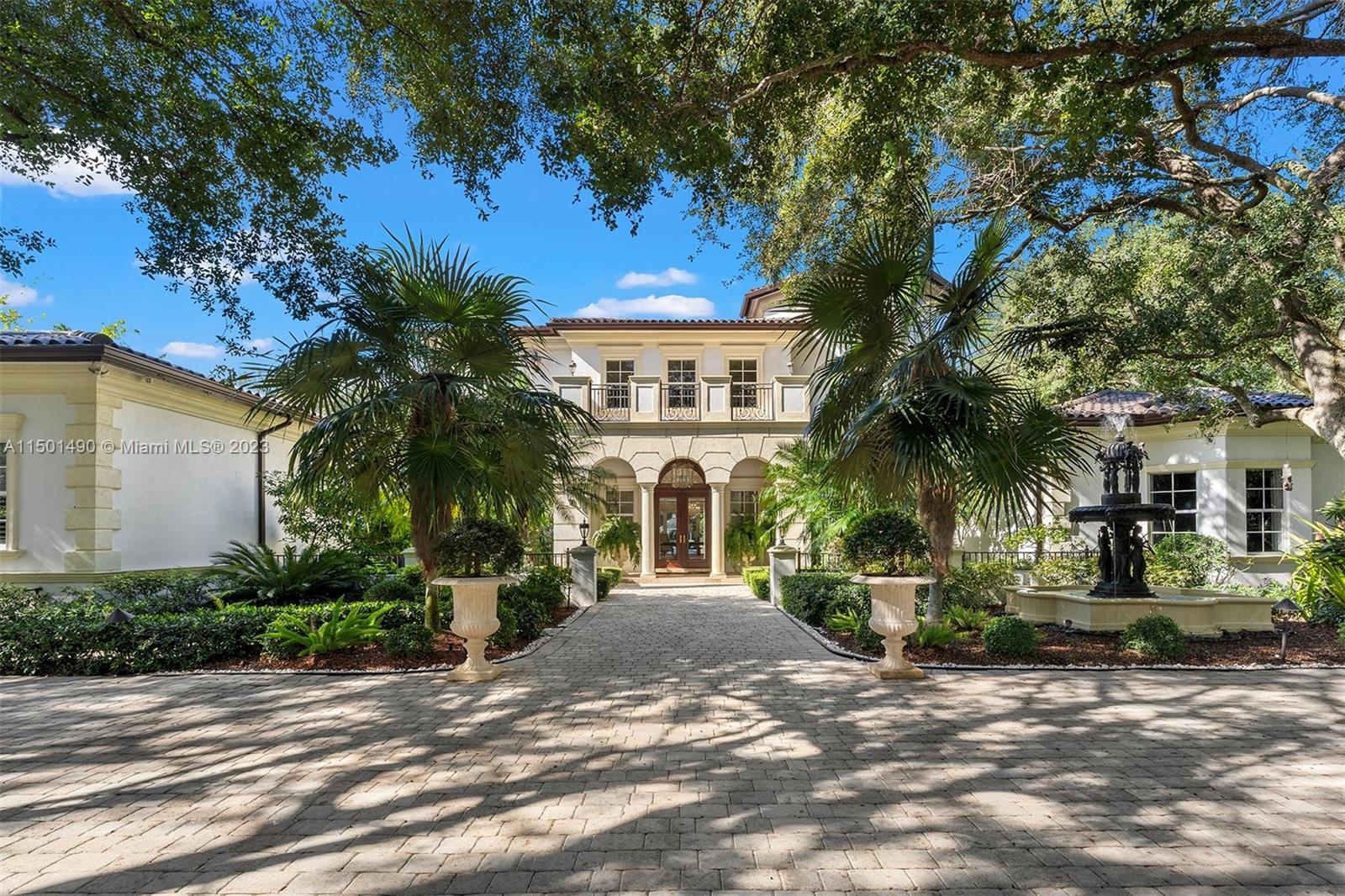 Exceptional N Pinecrest estate! Custom Mediterranean home on 1.15 acres, w/ 8 beds & 8/1 baths. This stunning residence boasts a grand entrance framed by oak trees & radiant landscaping w/ a fountain. The interior exudes elegance with a two-story layout including a spacious kitchen, top tier appliances, breakfast nook, & ground level luxurious primary suite with a sitting room, dual closets, massage rm, and private terrace.  Marble & wd flooring enhances the opulence. Additional highlights encompass a gym, game room, wine cellar, sauna, dual maids’ quarters, smart home integration, city water, & sound systems. 3 car garage w/ 1 car lift.  The resort-style backyard beckons with a large pool and jacuzzi. This unique estate epitomizes sophistication & elegance. Premier Pinecrest Schools.