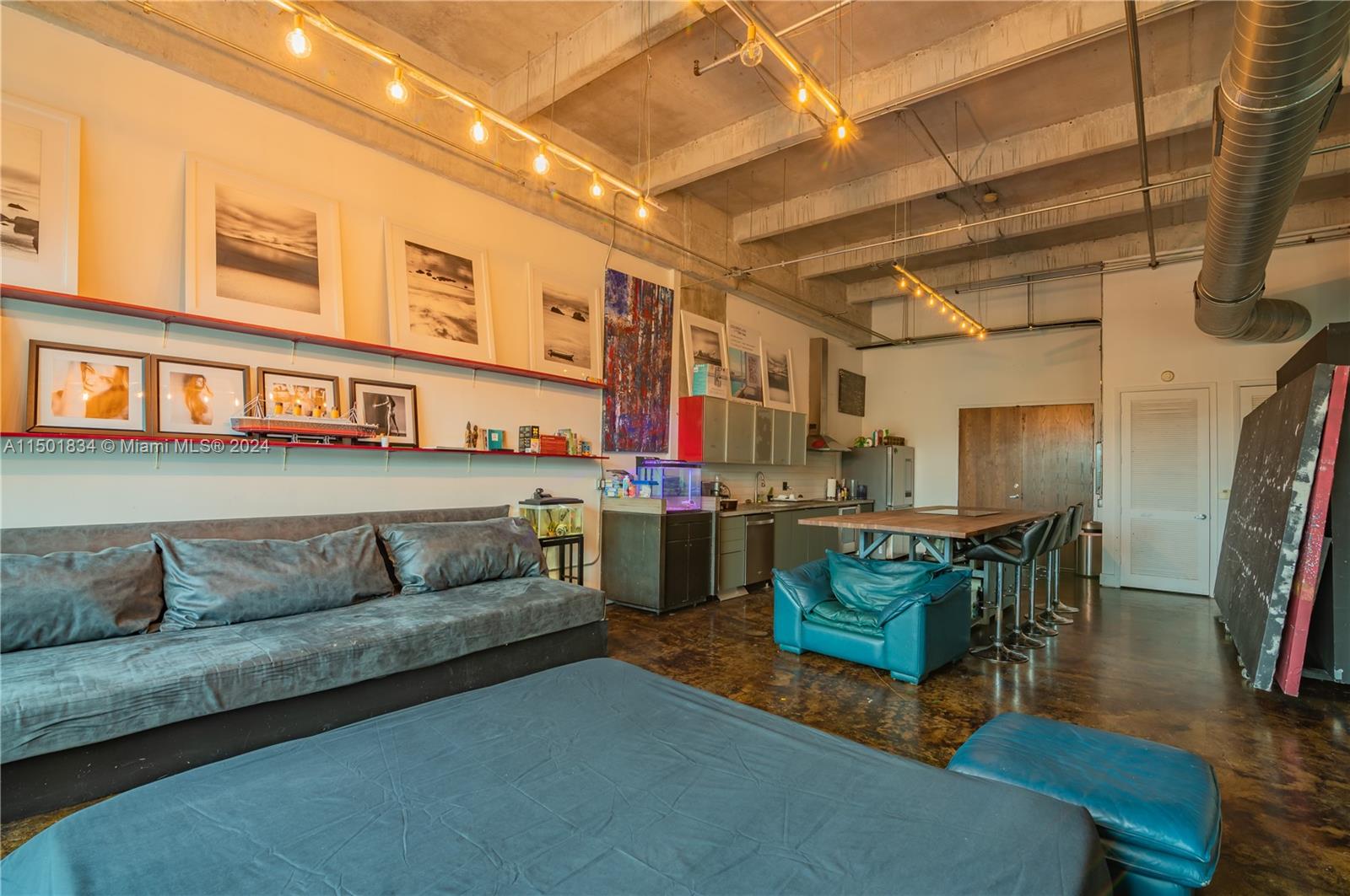 Gorgeous NYC style loft that offers 15ft ceilings, cement floor and an amazing open space! All new appliances and a built-in sleeping loft!Washer/Dryer in the unit, Central AC & spacious balcony!  Close to museums, shops and best dining.  This is a must see property in the best part of miami!  Building offers 24hr concierge, fitness room and a pool.