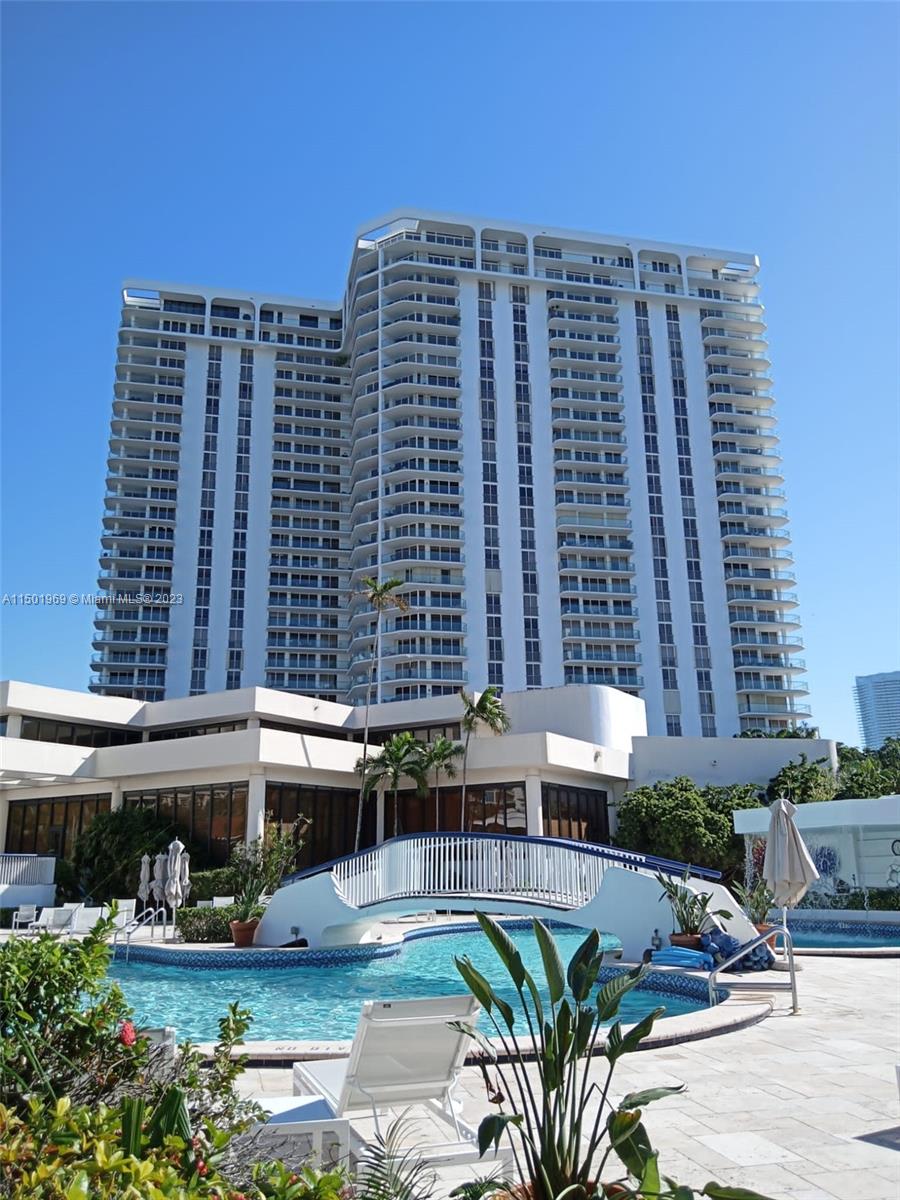 Building exterior and pool. North Tower