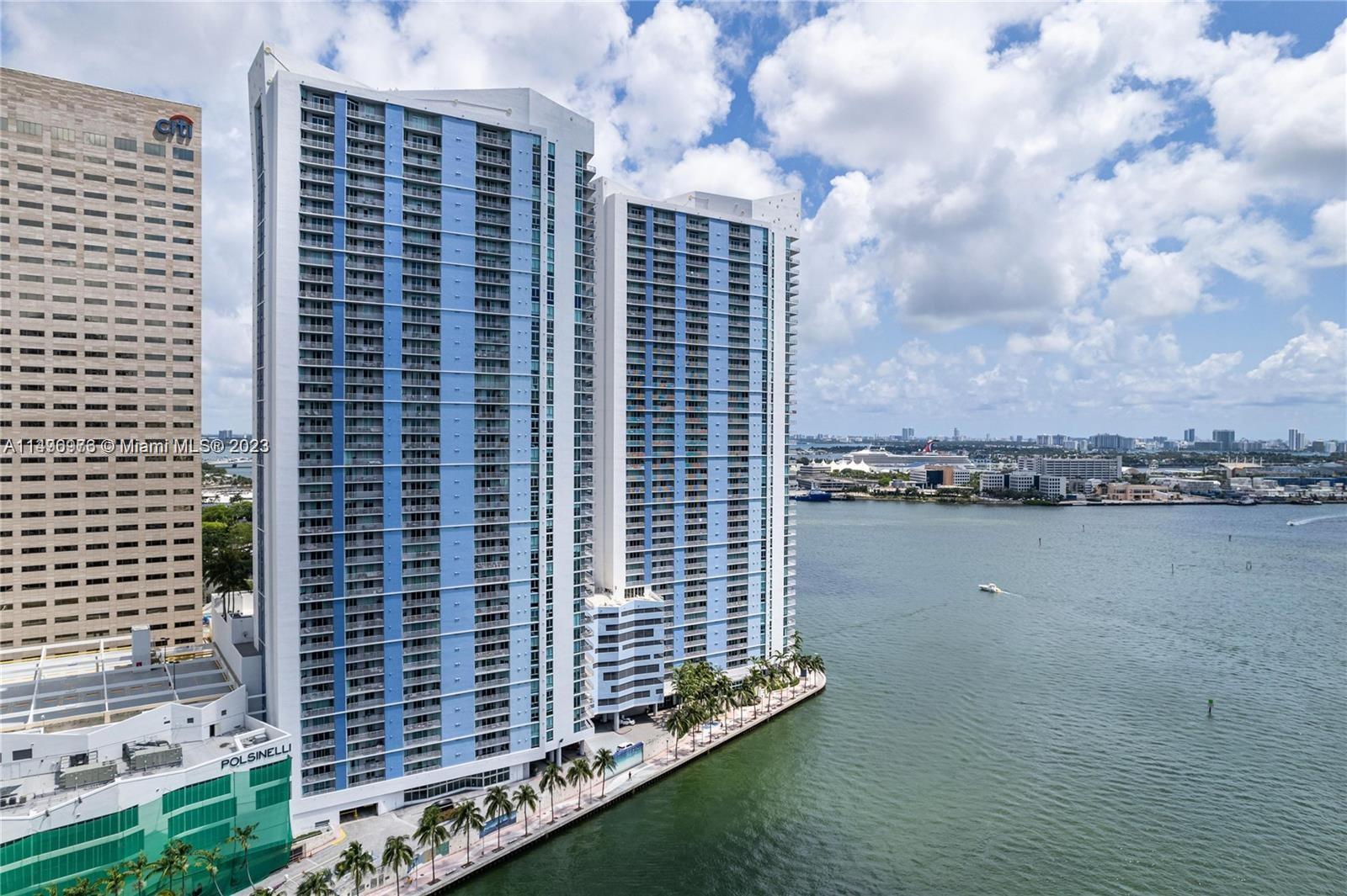 Unit with wood floors, European kitchen, granite counters, S/S appliances, washer/dryer, and freshly painted. Beautiful views of the bay, bayfront park, and bridges from the 22nd Flr. Direct access from the Miami Riverwalk Promenade to Bayside Marketplace. Building amenities are two pools, a jacuzzi, 2 gyms, 2 party rooms, a sauna, a kid's room, a business center, and EV charging. Enjoy the finest restaurants, entertainment, and shopping while living in the best location downtown.