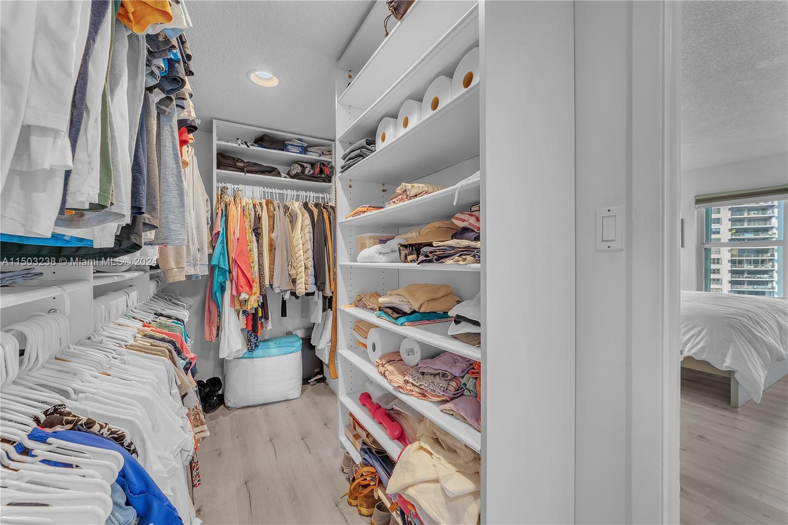 Spacious master bedroom with a walk-in closet, providing ample storage space for your convenience