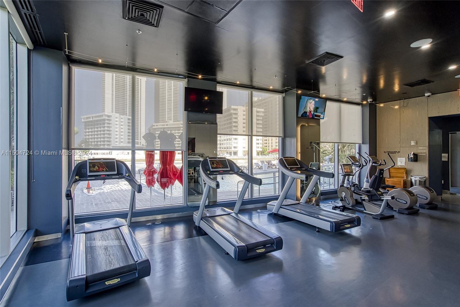 Full size gym with a pool and intracoastal view.