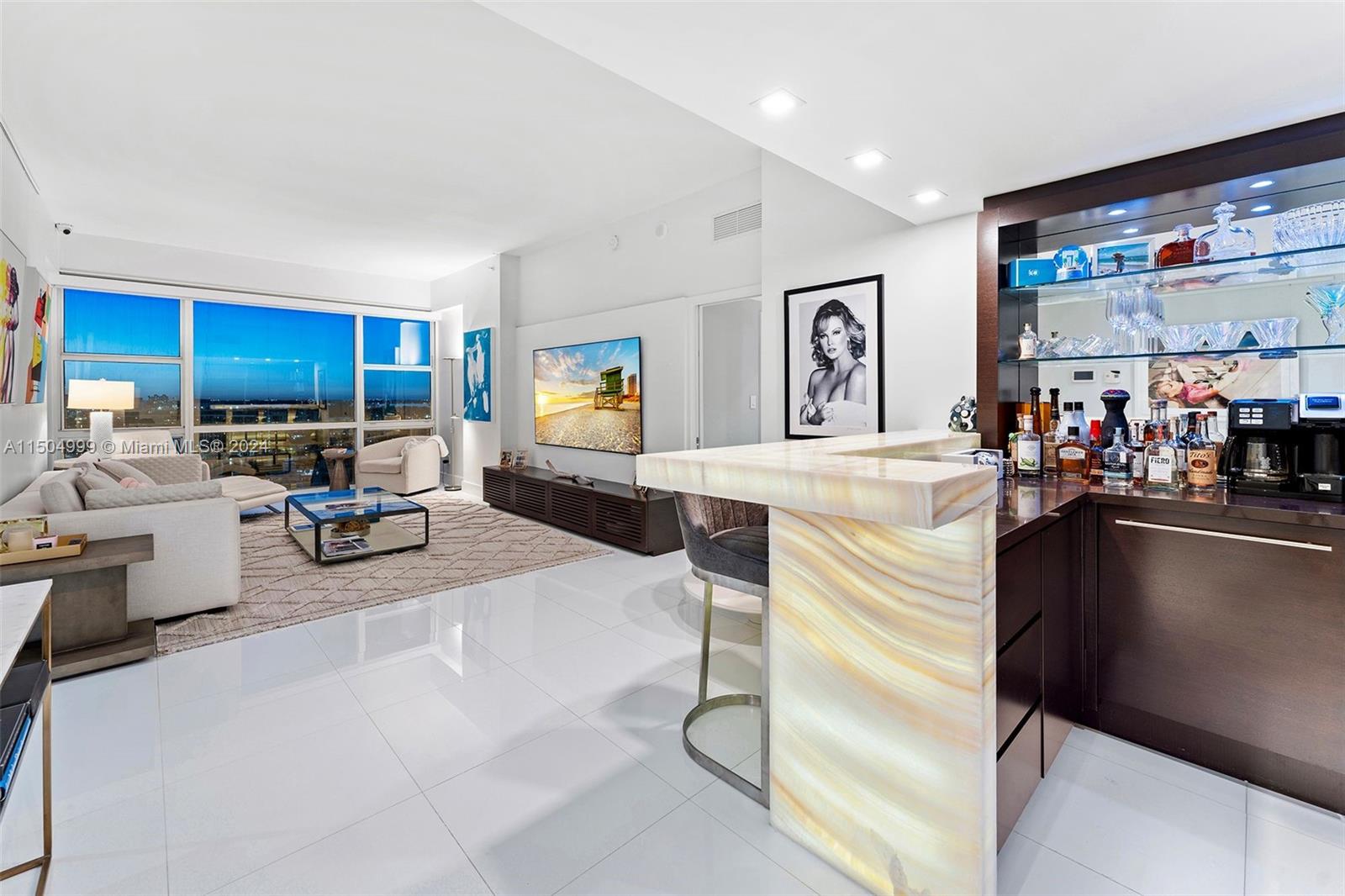 3/3 DOUBLE PENTHOUSE, one-of-a-kind unit w/ sweeping ocean, intercoastal, skyline & pool views w/ high end details, curated art collection, 2 primary suites, 2 separate living spaces, open concept kitchen w/ wine cooler, white onyx full bar w/lighting, tons of custom built-ins for storage. Exquisitely appointed, for entertaining & luxuriating. Experience Penthouse living at the Carillon, rated #1 Wellness property by Conde Nast. 100's classes/week, 70,000 SF Fitness/Spa, hydrotherapy, sauna, steam, regenerative medicine, salon, Fitness, PT & wellness staff, 4 pools, 2 Pilates Studios, water fitness, Gyrotonics, Barre, Zumba, TRX, concierge, Michelin pop-up restaurant on-site, juice bar, private beach w/food & towel service, 24-hr security, valet, boardwalk, bikes & gardens. TXT for Info