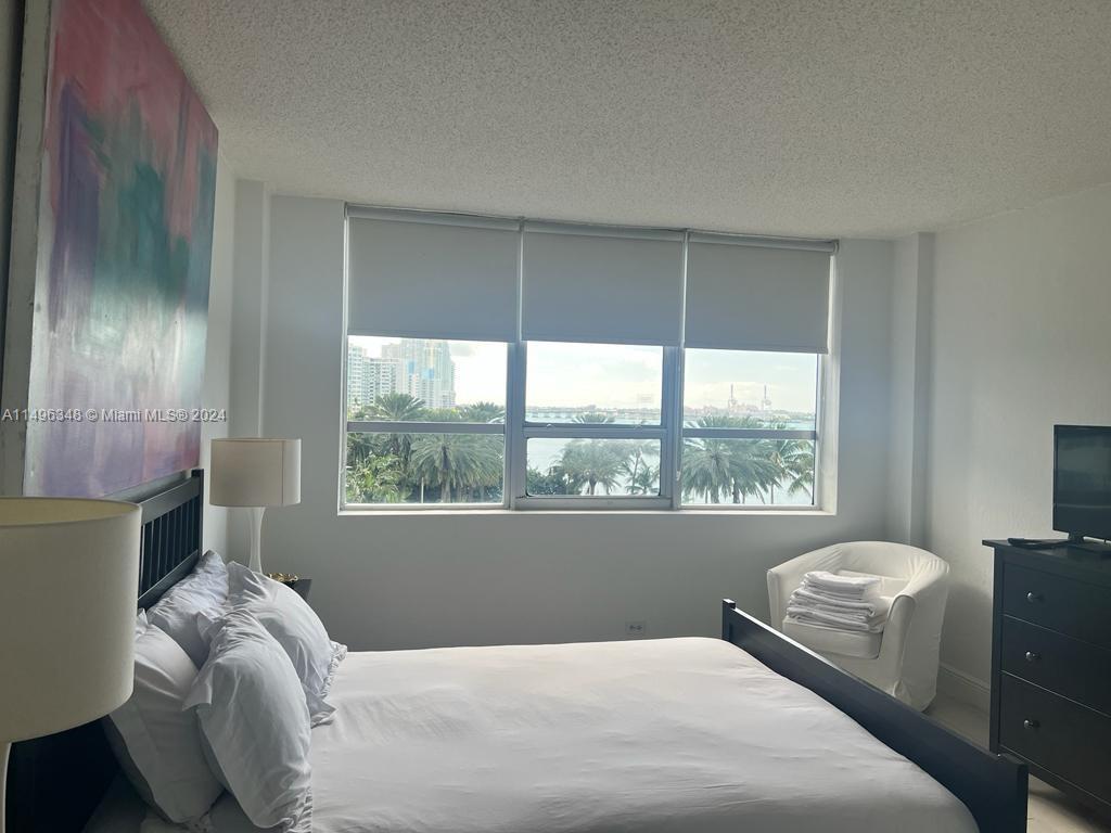 Primary bedroom with gorgeous bay views