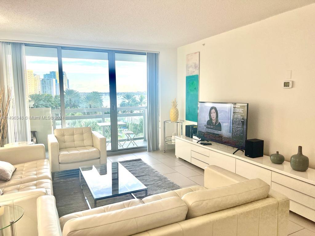 Looking out living room to balcony and bay view