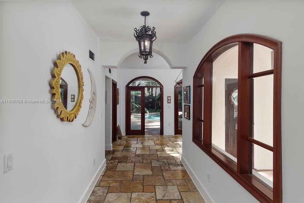 HALLWAY LEADING TO LAUNDRY AND OFFICE