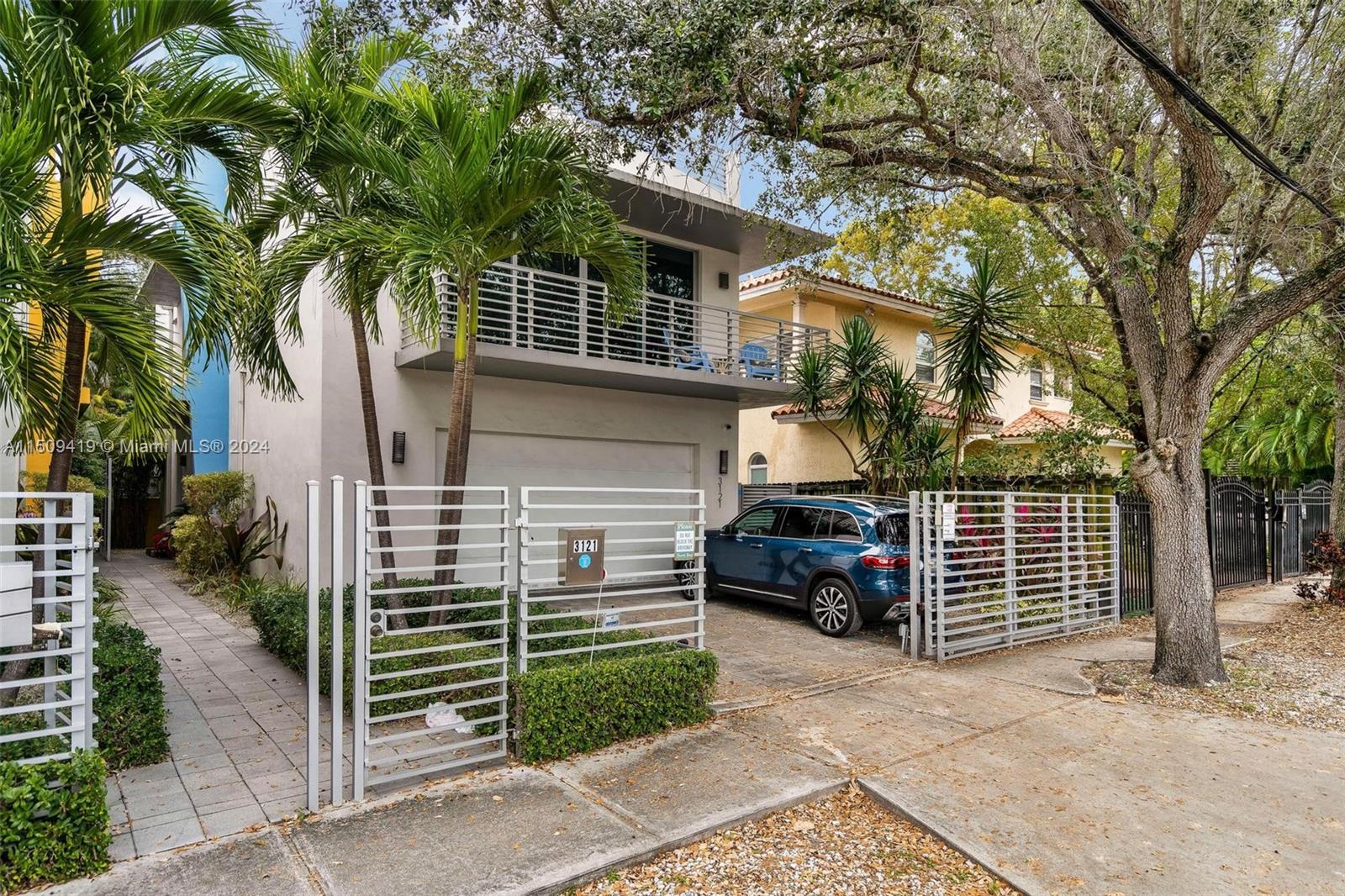 RECENTLY REPRICED - UNIQUE PROPERTY- Detached townhome in central Coconut Grove location with a rare 2-car garage, pool & rooftop. This 3-bed, 3.5-bath home offers 2,410 SF of modern living, featuring new hardwood floors, sleek new kitchen, & hurricane impact windows & doors. Main level includes a foyer, gorgeous kitchen integrated w/ample living & dining area, powder room & generous windows for natural light. Second level has laundry room & 3 bedrooms w/en suite bathrooms. The principal bedroom boasts a walk-in closet & private balcony facing the pool. Third level offers ample rooftop terrace. No HOA. Prime location, across from Kirk Munroe Tennis Center, steps from Coconut Grove Elem, Cocowalk & the vibrant life at Coconut Grove. Experience unique living in this exclusive residence.