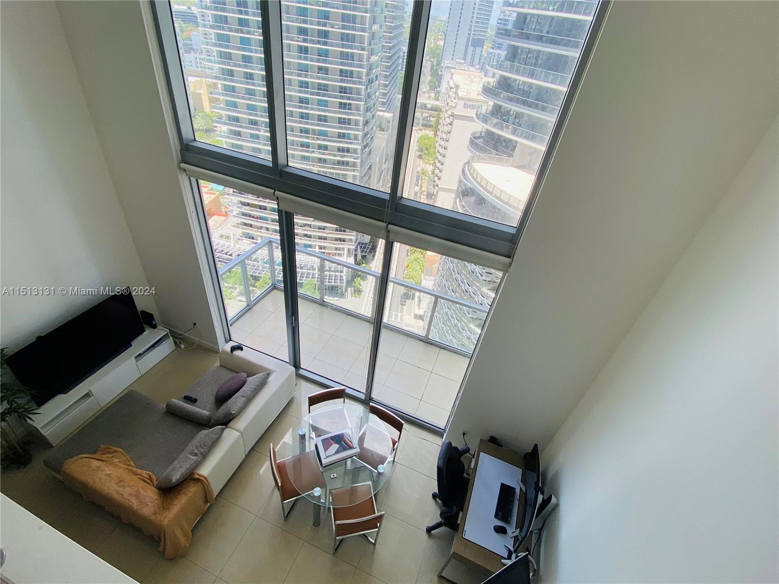 Rare two story apartment located in the heart of Brickell. Extraordinary layout: kitchen, living room and half bath downstairs. Breathtaking skyline views. Freshly painted with recently renovated kitchen and bathroom. Designated parking & twenty four hour doorman and valet parking. The building also offers a gym, pool, billiards room and much more. Downstairs you will find all of Brickell's main attractions at the tip of your fingers. The building has two entrances, by Brickell Ave. & S.Miami Ave. Great investment opportunity