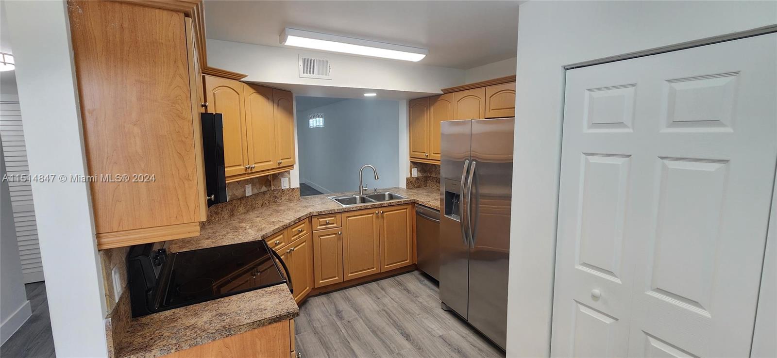 Kitchen with new lights and new Stainless Steel Appliances