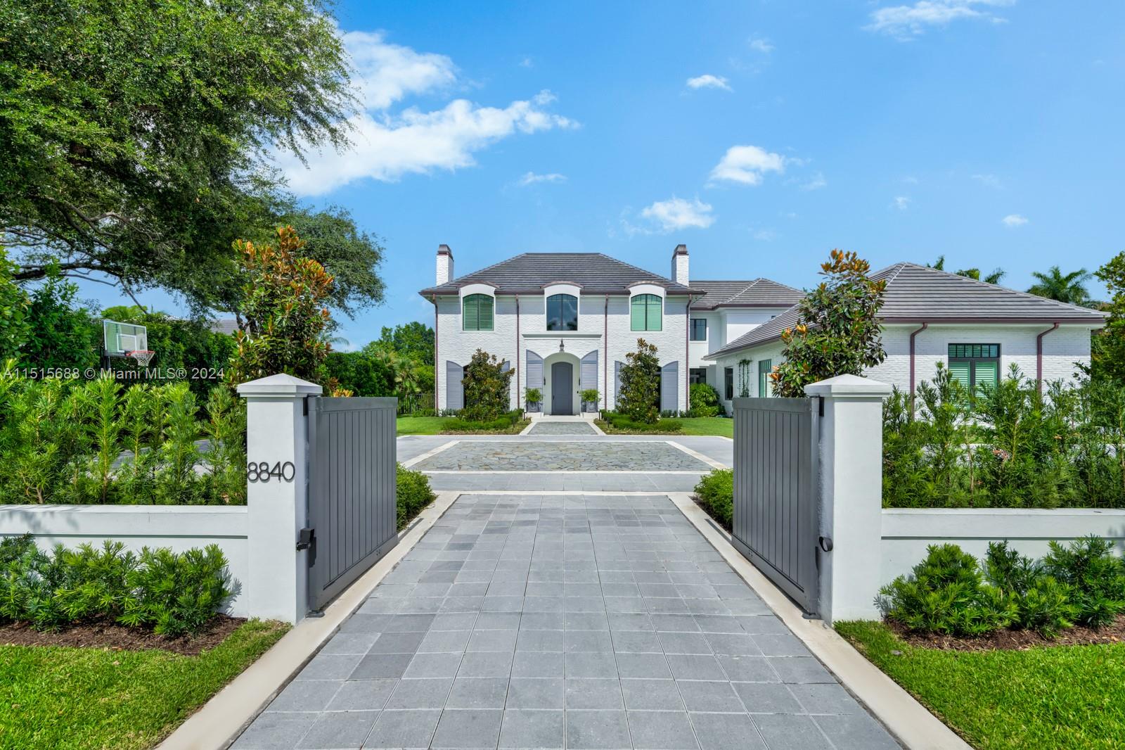 Welcome to this stunning home in N. Pinecrest. This Classic European design exudes elegance and sophistication. 7 beds & 7.5 baths, formal living w/bar and 380+ temp. controlled wine cellar, family rm w/surround sound, breakfast rm for informal daily use, formal dining and butler’s pantry for traditional dinner parties. A showstopper kitchen features a custom L’atalier Paris range, quartzite tops, hidden appliance cabinet, commercial grade exhaust. A whole-house 80 kW generator, elevator, tankless gas water heaters with circulating pump, and Smart-home system. A/C in 4-car garage with room for a car lift. The backyard is perfect to enjoy the outdoors, shallow pool and hot tub, a cool misting system in the covered loggia, Full summer kitchen and plenty of space for entertaining year-round.